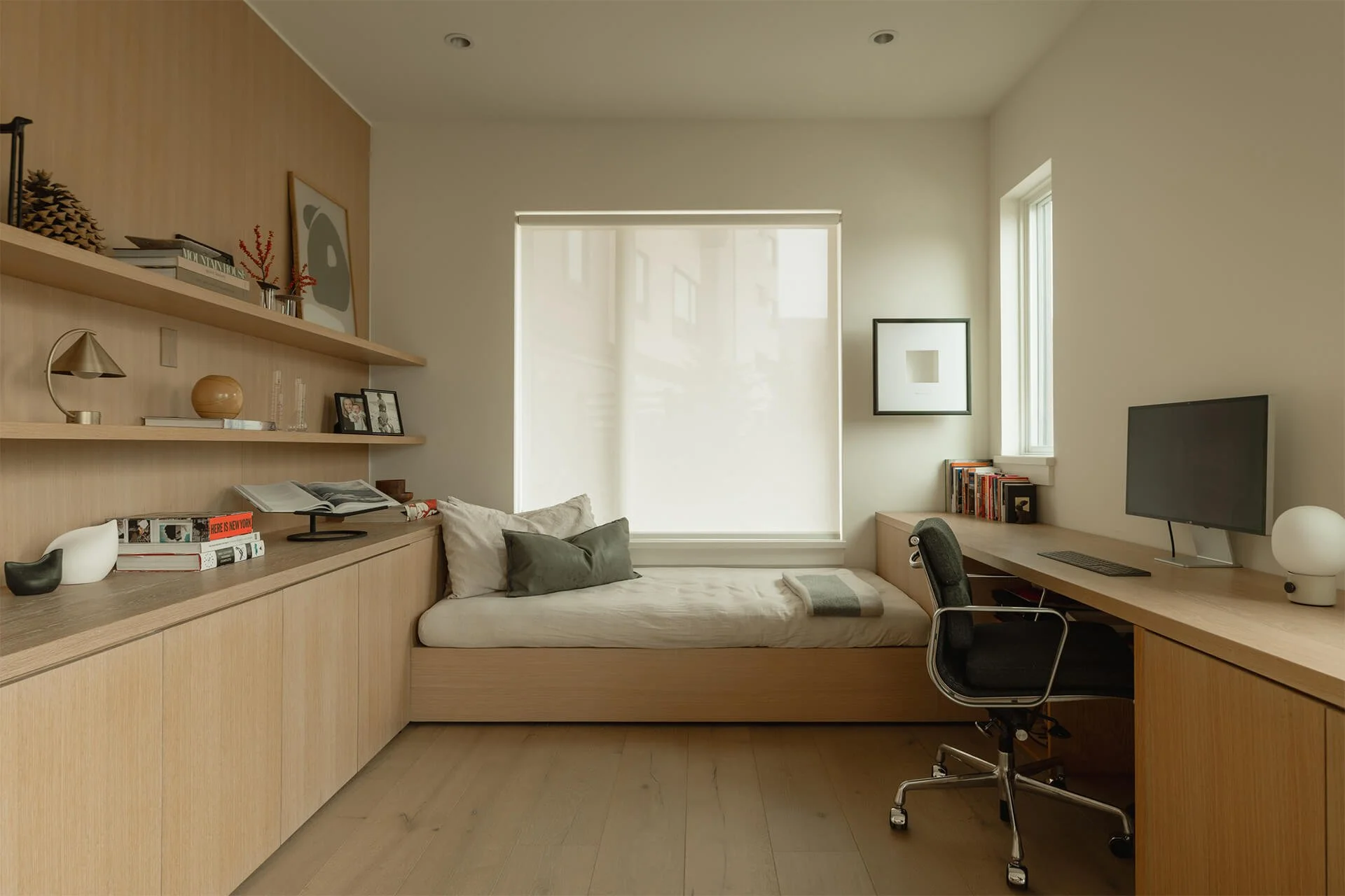 Modern office with custom white oak built-ins and daybed.