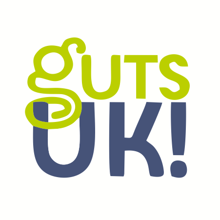 The phrase "guts UK!" written in stylized green and blue letters.