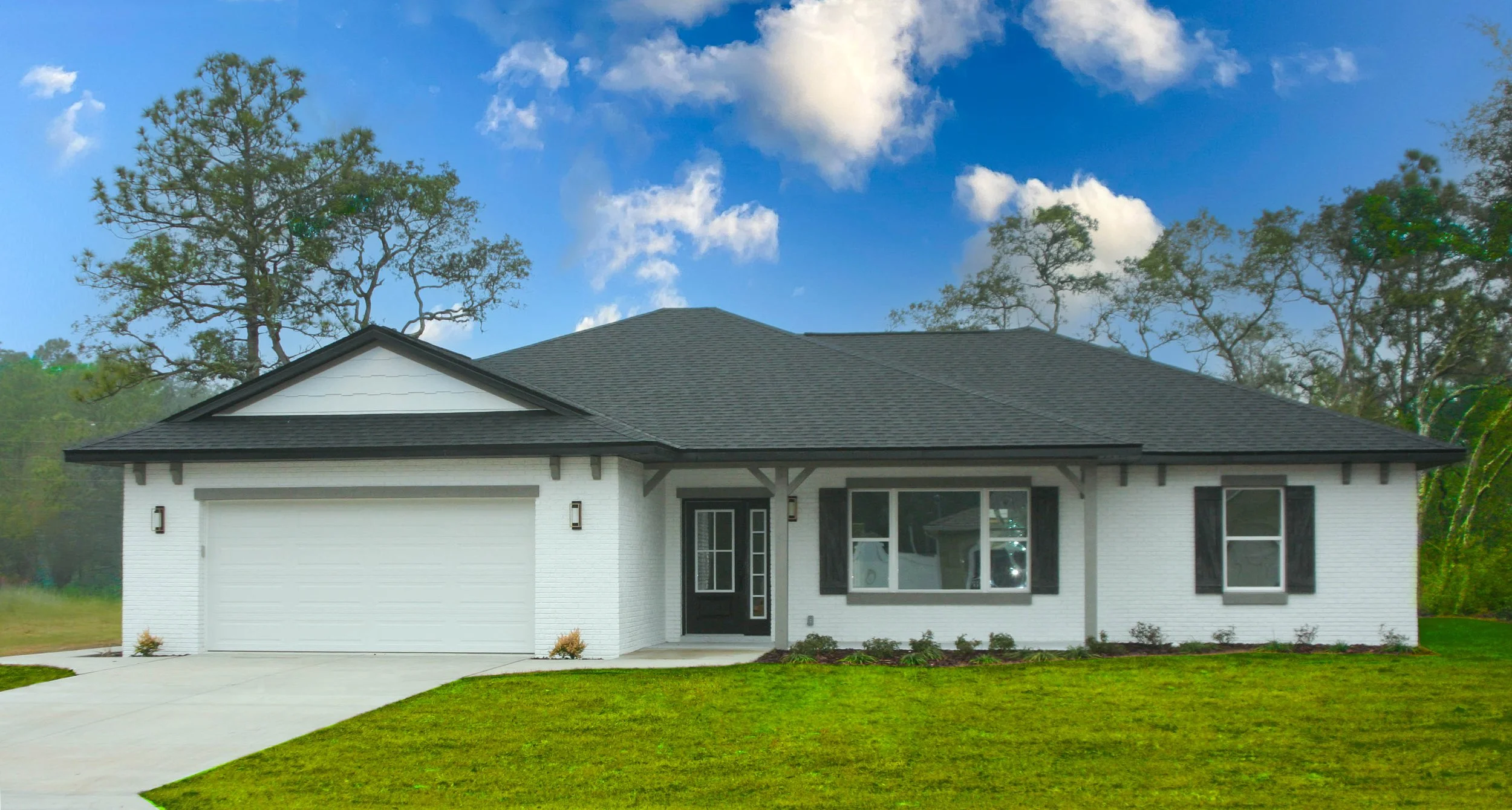 Newly constructed Citrus Springs home with white painted brick exterior, a charcoal gray shingled roof, large front windows, a two car garage with white door. The homes has gray accents on the corbels and porch beams and a black front door