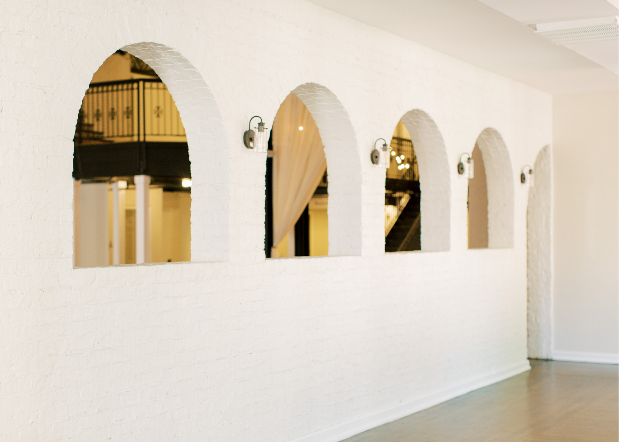 Our event space offers a crisp, clean background for your unique event. With white original-brick walls, endless floorpan options, custom lighting packages, and tables and chairs… we’ve got it all!