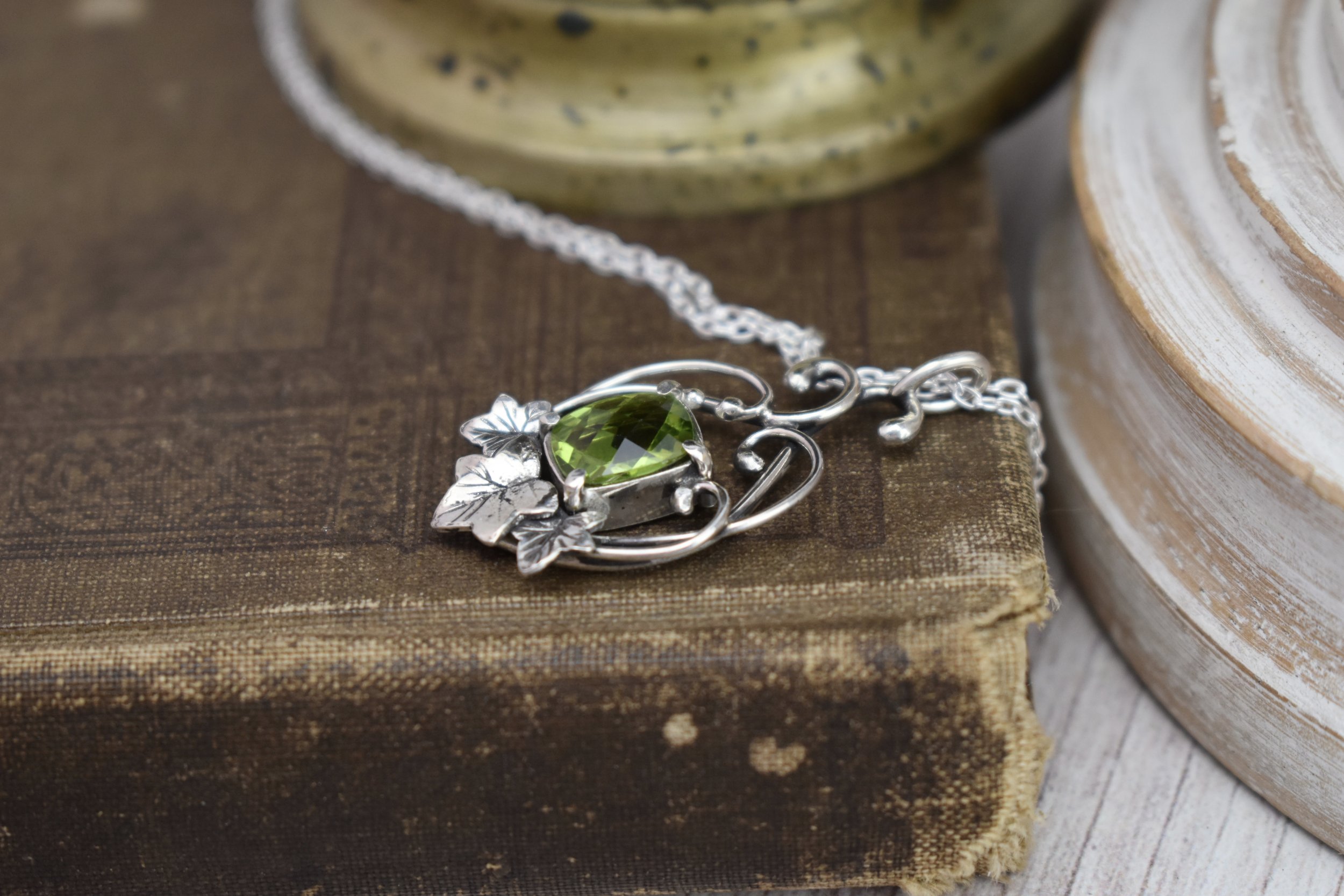 ivy leaves sterling silver necklace with curling vines and peridot gemstone