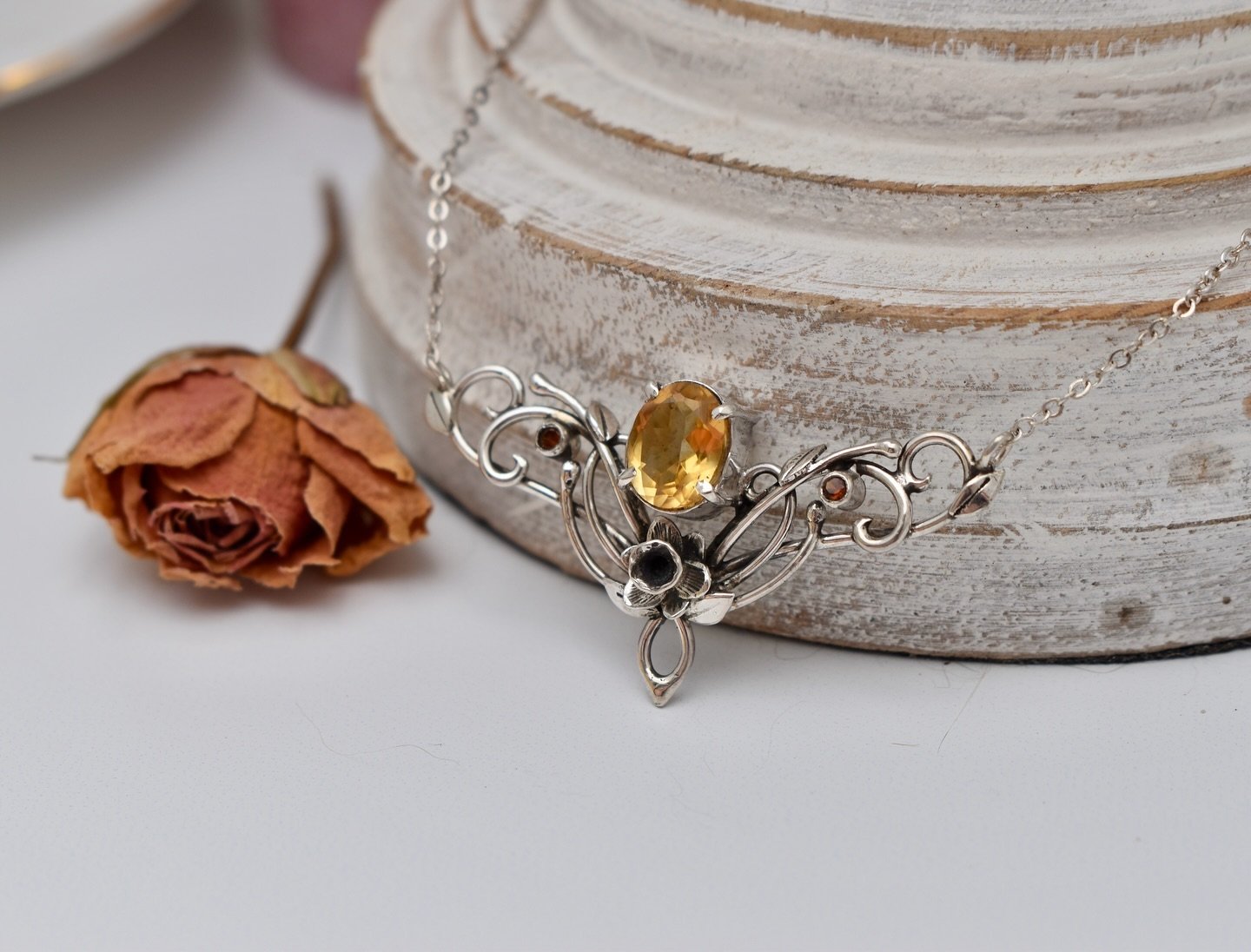 Daffodils are about to bloom in the Spring Court! This months drop will feature beautiful delicate daffodils with vibrant yellow Citrine gemstones. Perfect for mild sunny weather, whispy gossamer dresses, and walks in the rose garden. Coming March 31