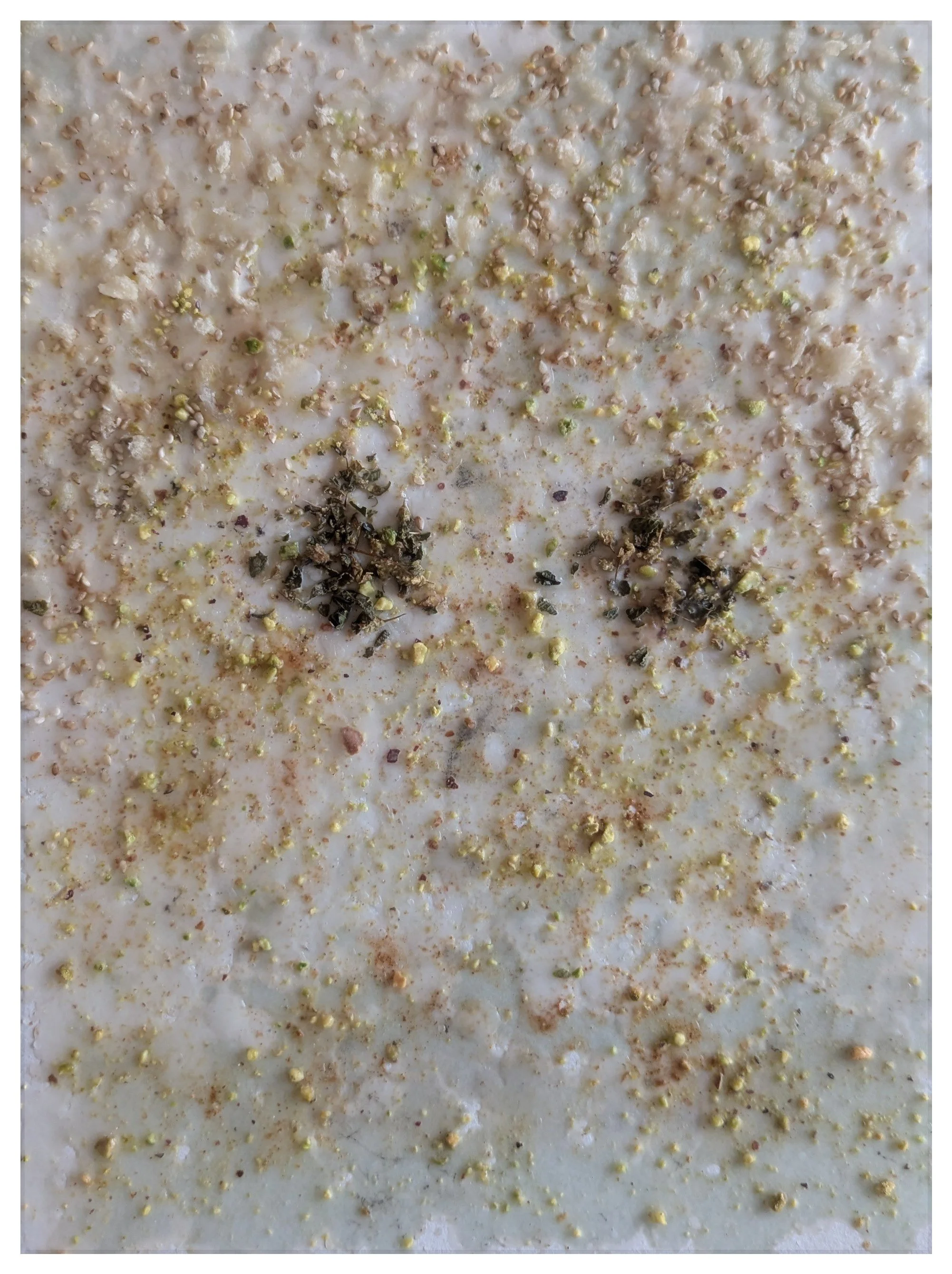 My Baby (Mono No Aware), 2025 sesame seeds, canela, panko, rosemary, pistachios, wax on paper 12 x 9 x 1 in. 30.48 x 22.86 x 2.54 cm