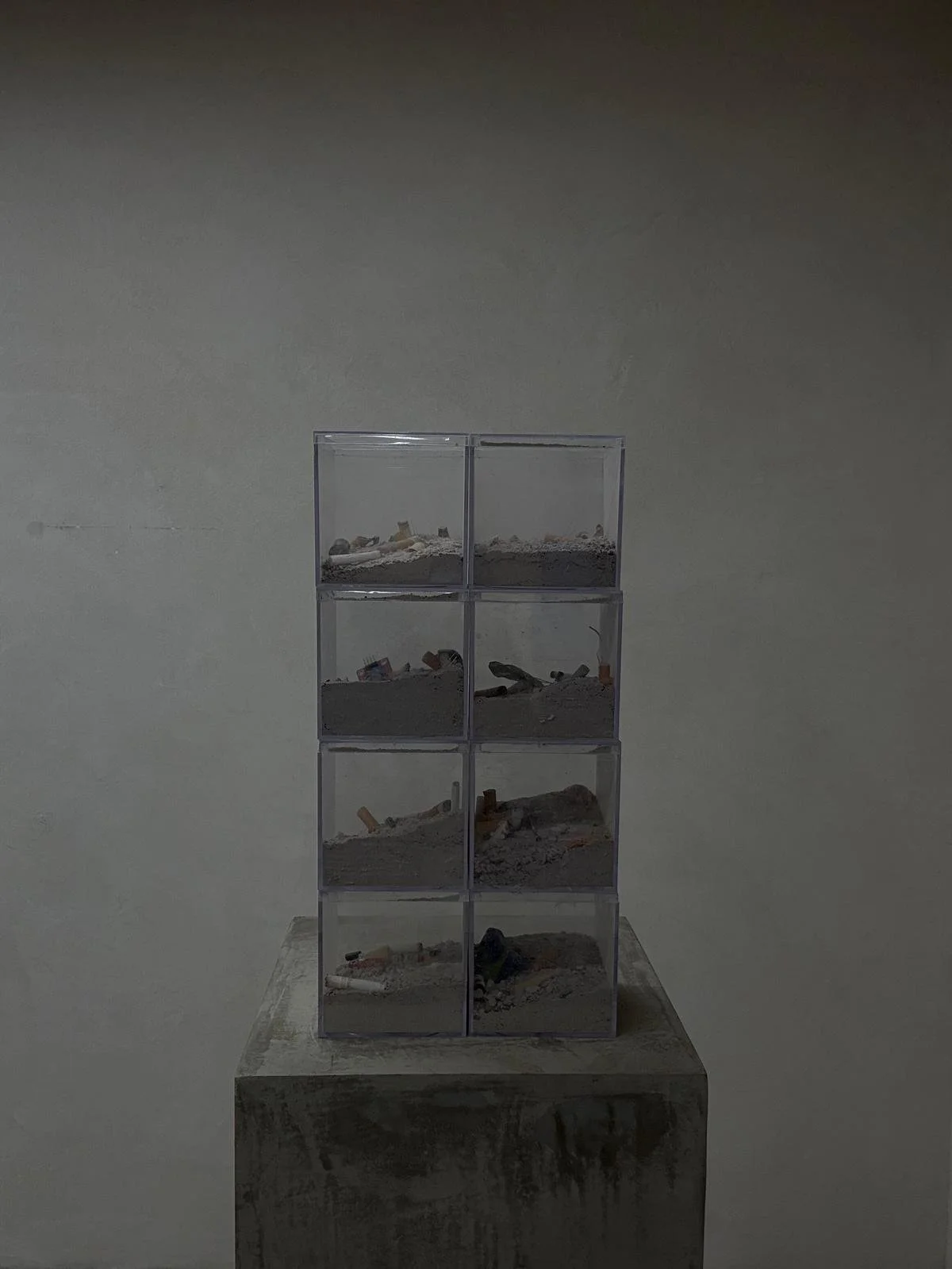 Self Portrait of myself in the ashtray, 2025 plastic acrylic boxes, cigarettes, ash, hookah, cigar ash, coconut shell coal, analog sensors, capacitors, LED lights 15⅝ x 8 x 8 in. 39.69 x 20.32 x 20.32 cm