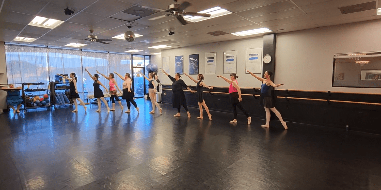 Adult beginning ballet dancers at the barre at The Dance Barre in Bryan, Texas