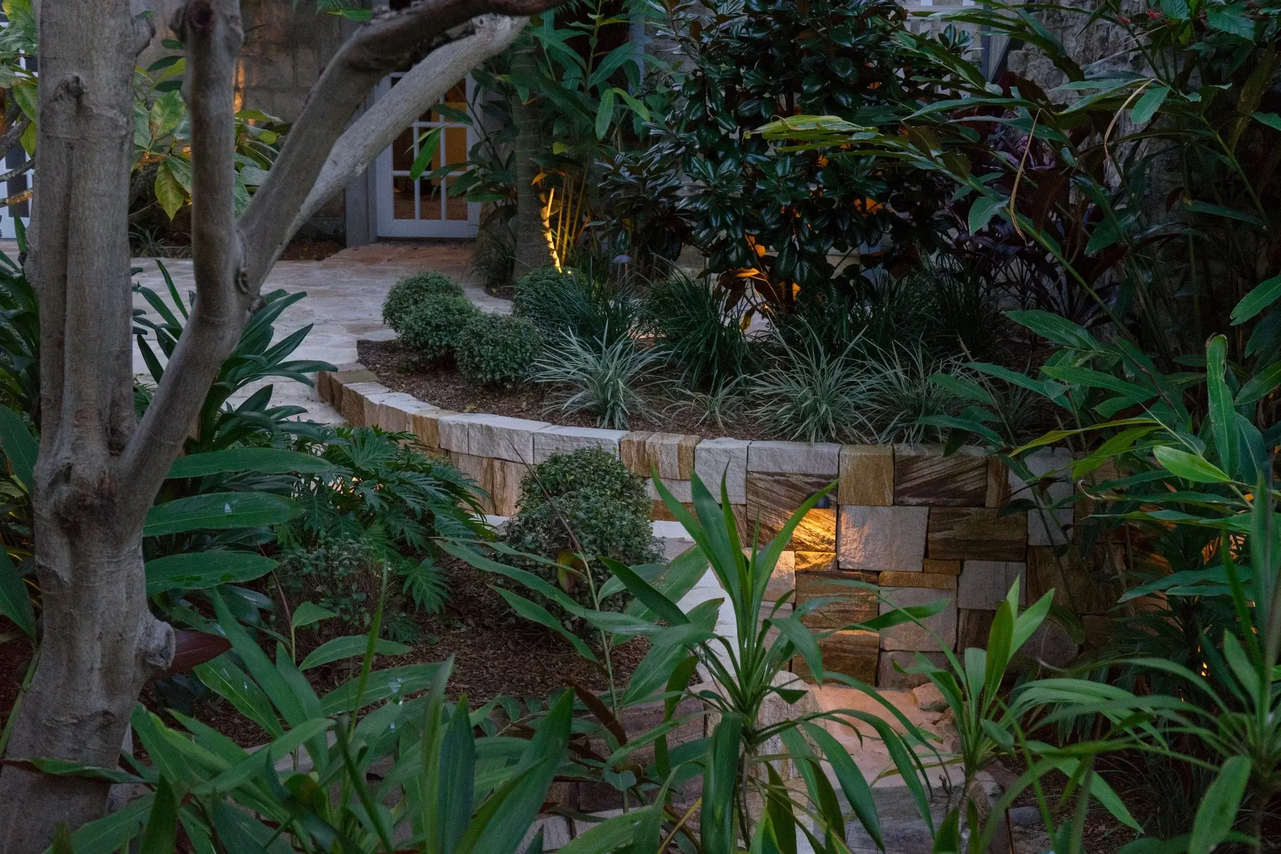 Outdoor garden area with lush tropical plants