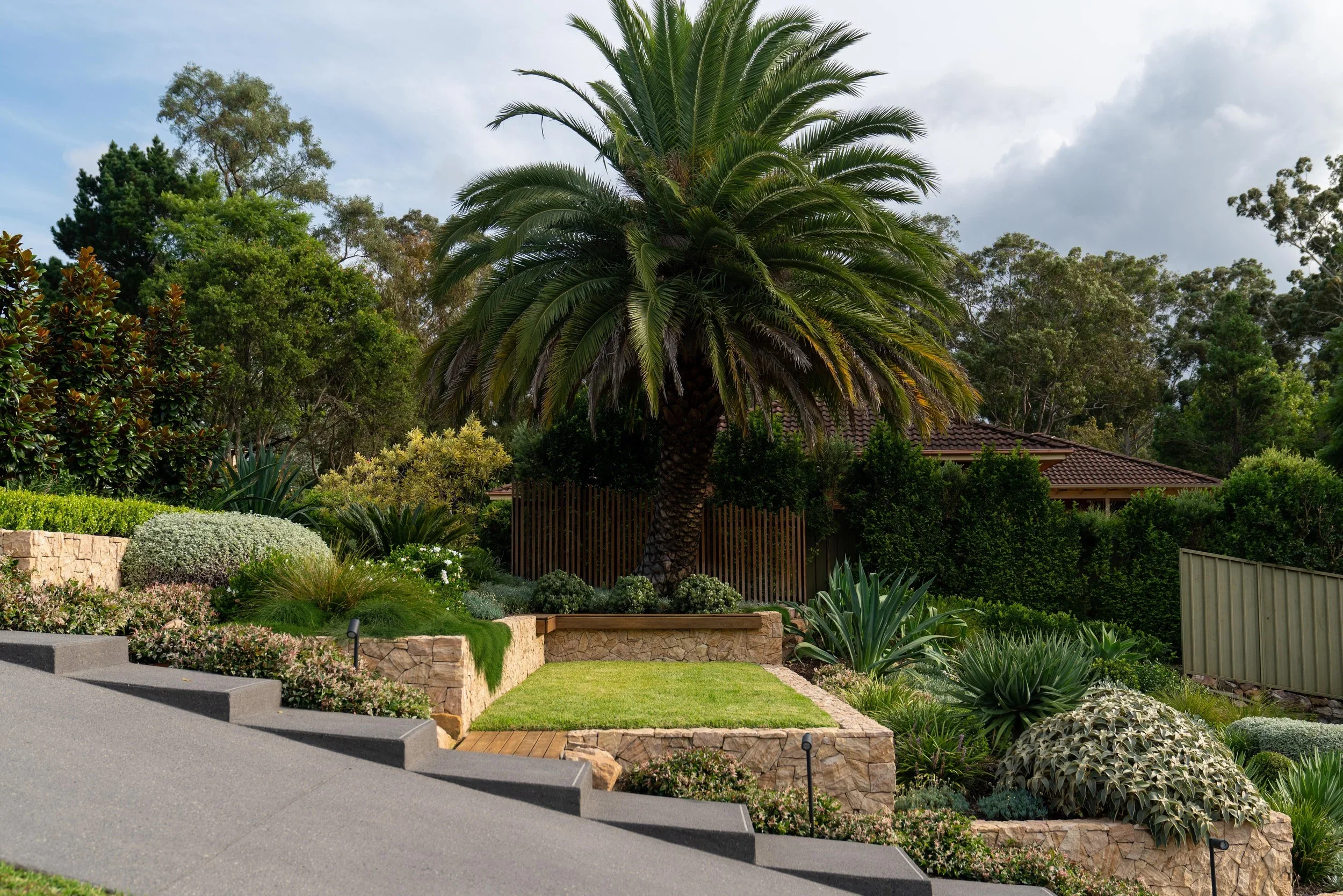 Modern house exterior with garden and driveway