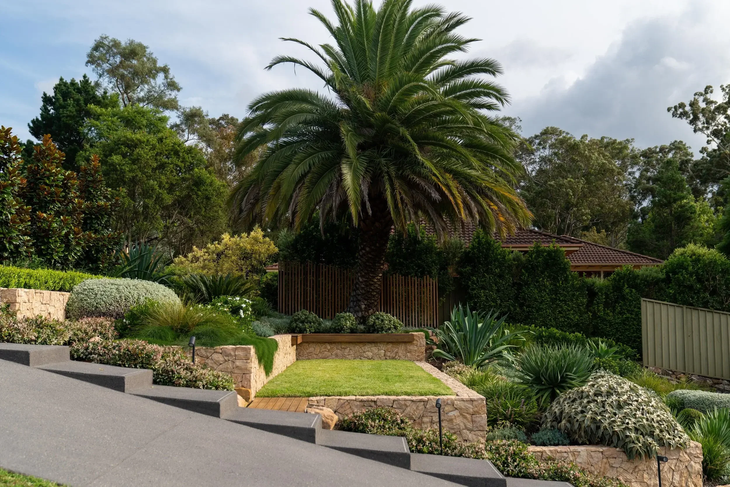 Modern house exterior with garden and driveway