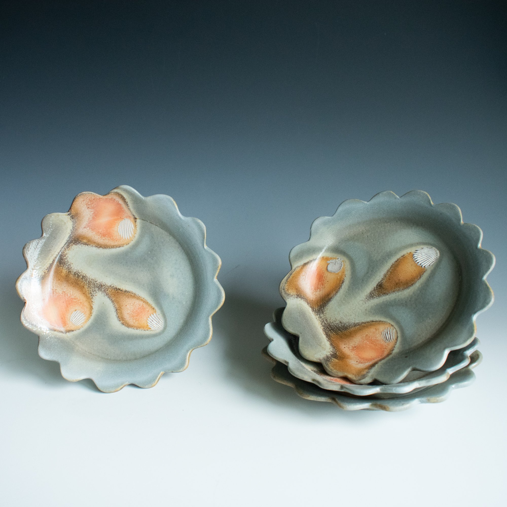 Scallop plate set, cone 11+ train kiln, winter 2025