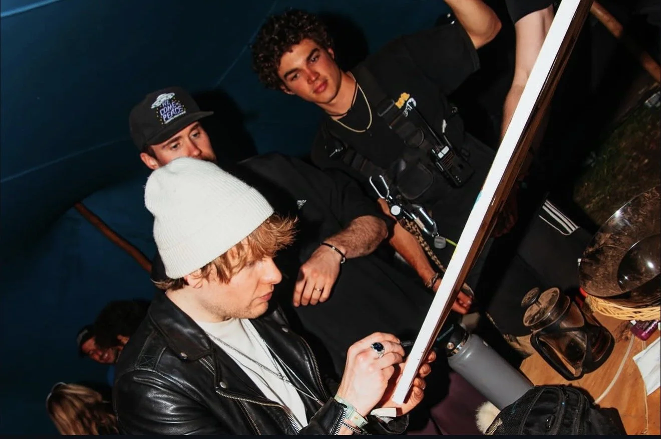 Bob Moses signing artwork after performing alongside them live