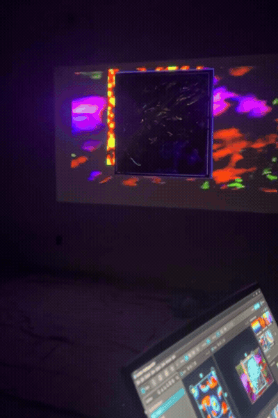 Projection mapping over Man I Need painting