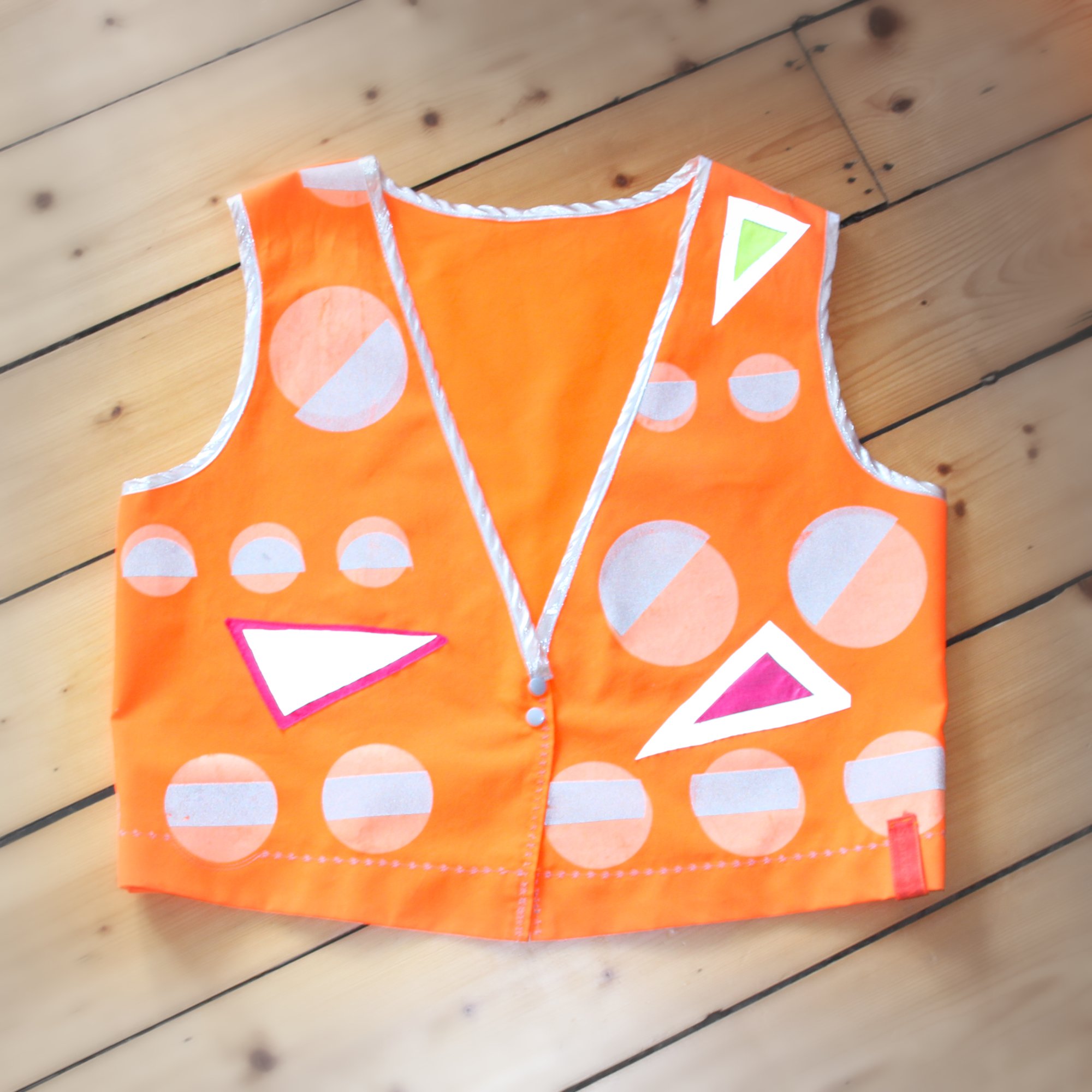 SparklewearOrangeGeometricVestFront.jpeg