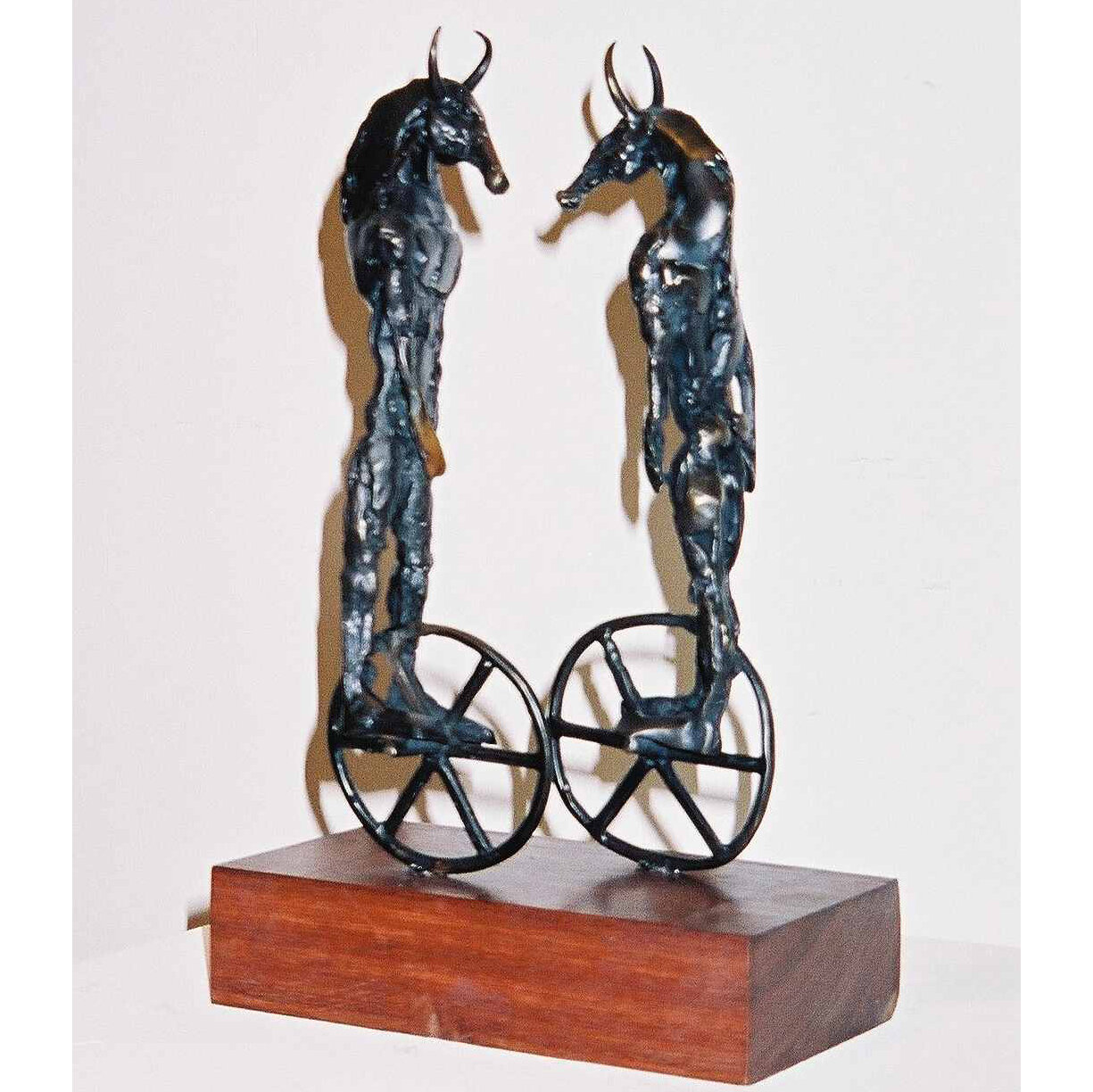 "Rolling On By" 2004
Bronze, Wood
28x17x9cm