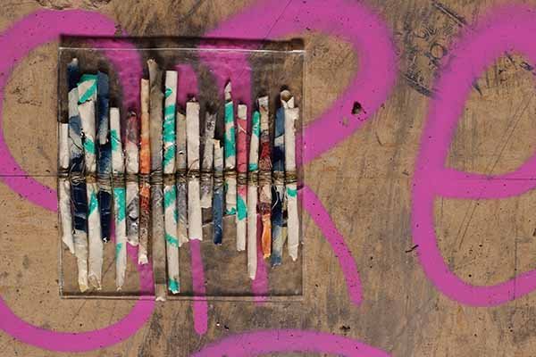 Wall Story No. 7, 2020, peeled paint, string, resin, 20.8 x 21.3 x 1 cm