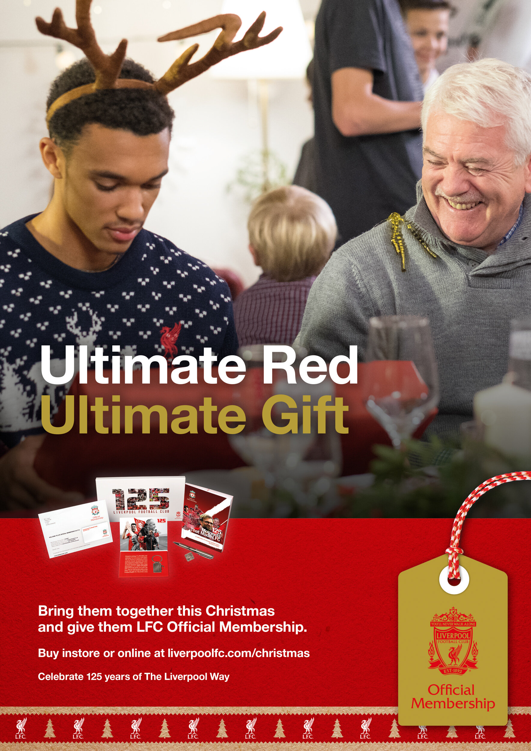 Christmas-themed promotional image for Liverpool Football Club, featuring a young man with reindeer antlers and an older man smiling, with gift items and a red gift tag promoting LFC Official Membership.