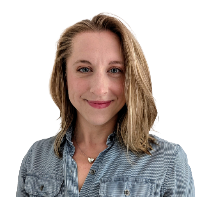 A woman with shoulder-length blonde hair, wearing a light blue denim shirt, smiling at the camera against a white background.