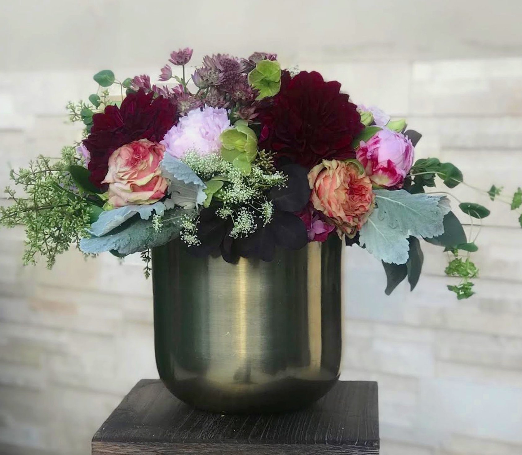 Dahlia, Seeded Eucalyptus, Astrantia, Queen Anne’s Lace, Dusty Miller, Peony, Garden Rose, Hellebores, and Sweet Pea