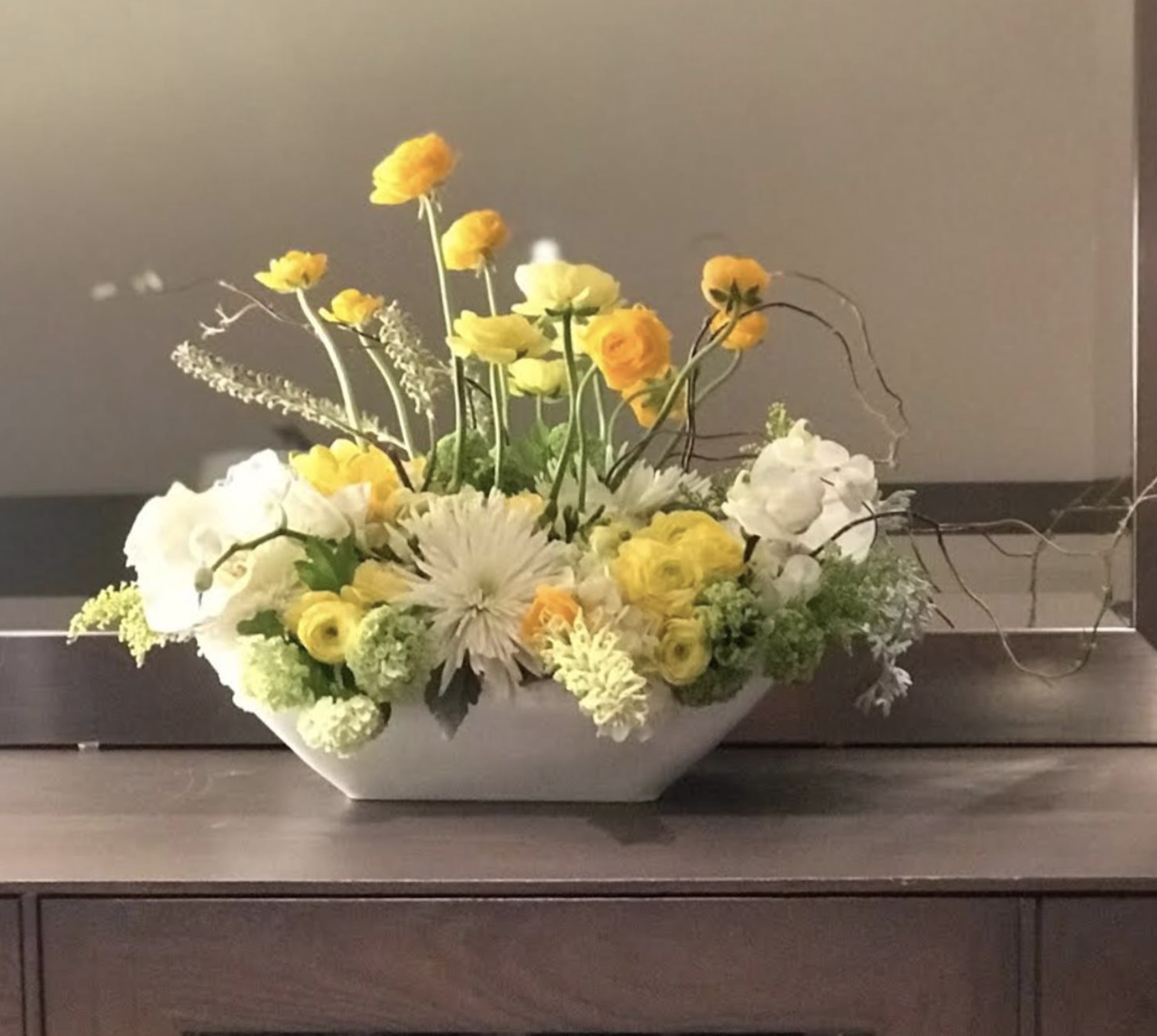 Chrysanthemum, Hydrangea, Rose, Cloony Ranunculus, Grevillea, Dusty Miller, Seeded Eucalyptus, and Willow Branch