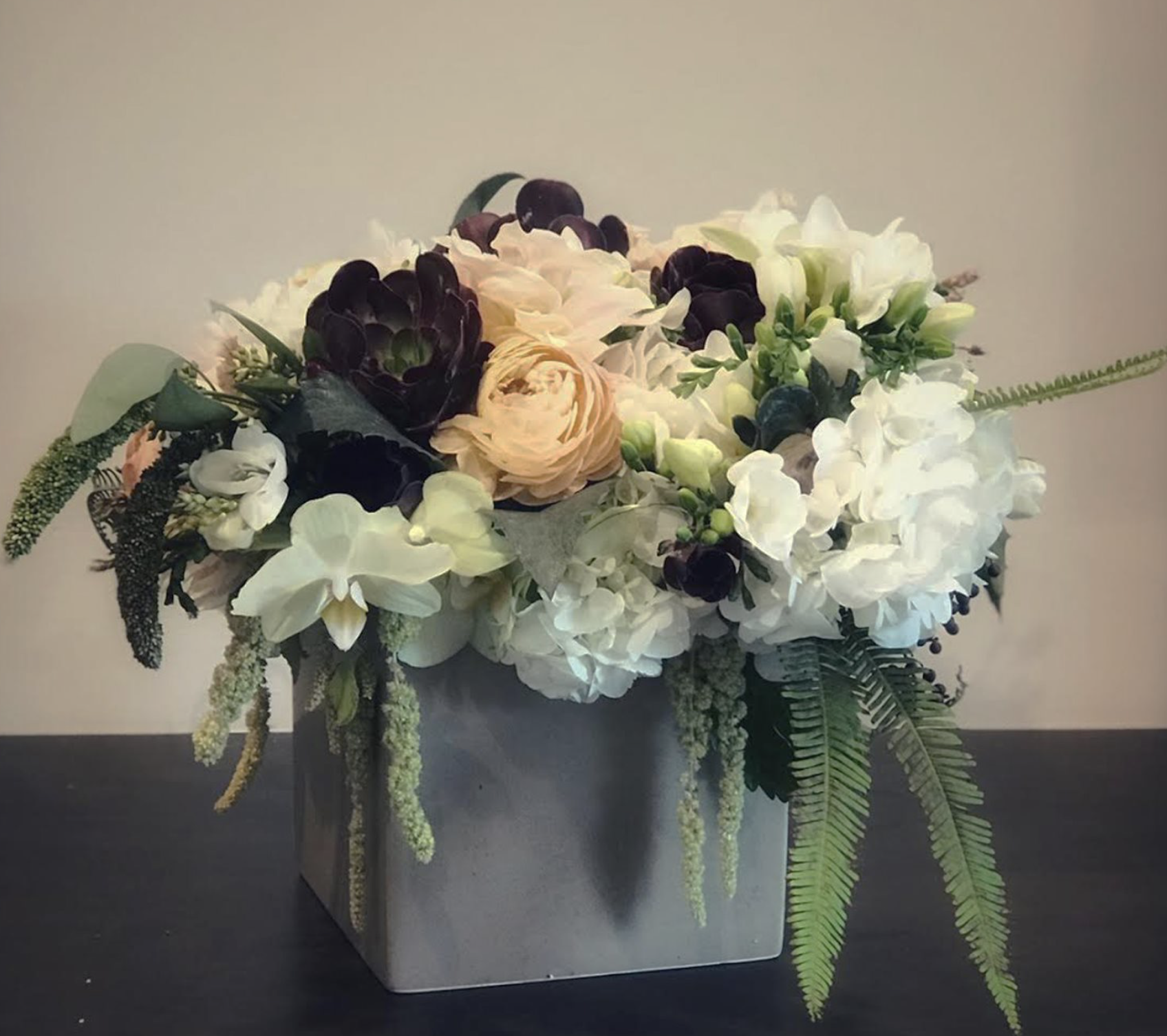 Hellebores, Orchid, Amaranthus, Succulent, Hydrangea, Freesia, Fern, and Gumdrop Eucalyptus