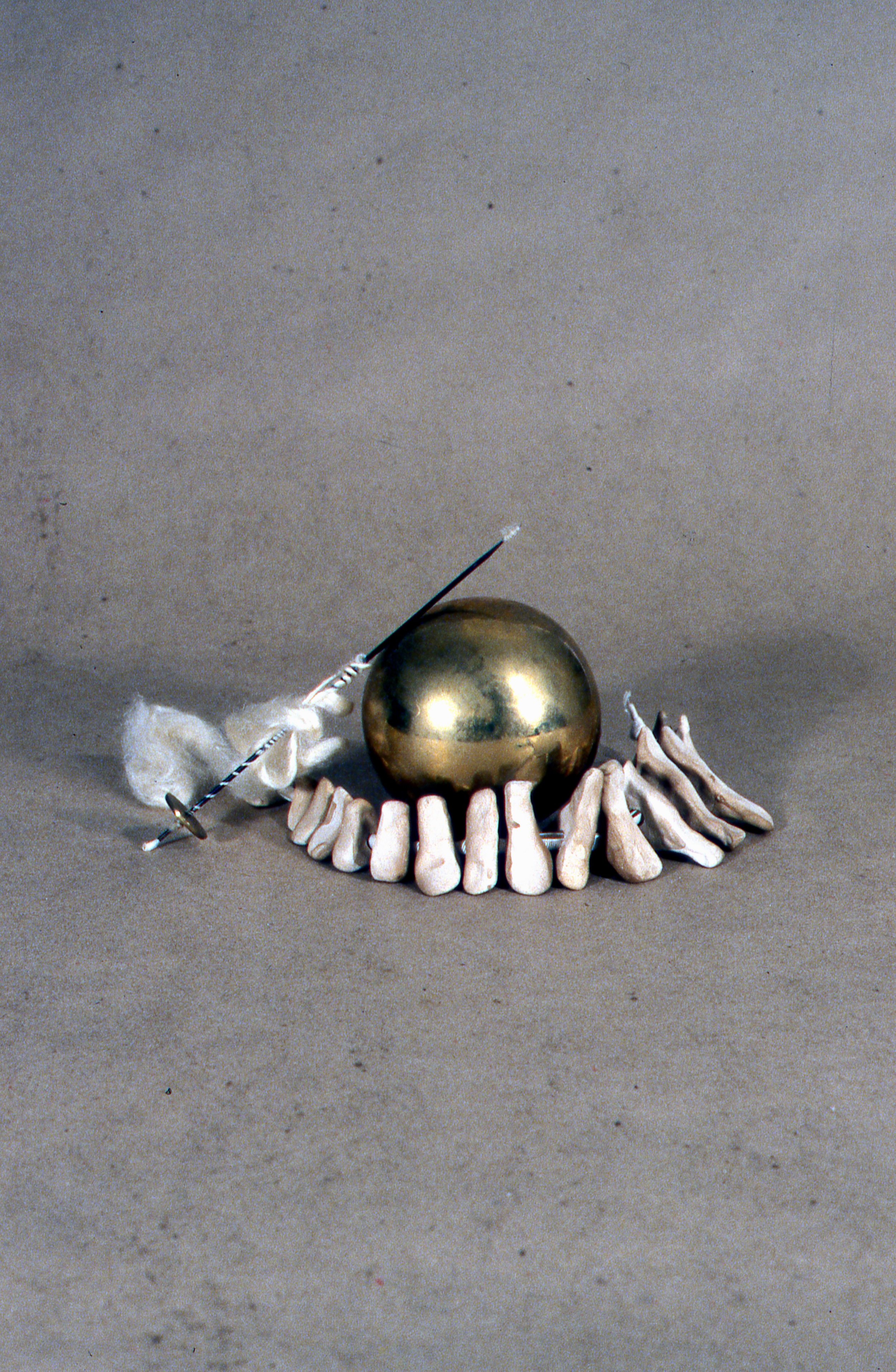 Ghandi's Legacy, KBDesrosiers, 12%22x12%22x9%22, brass sphere, spindle and silk fiber, fired and stained clay forms and ribbon.jpeg