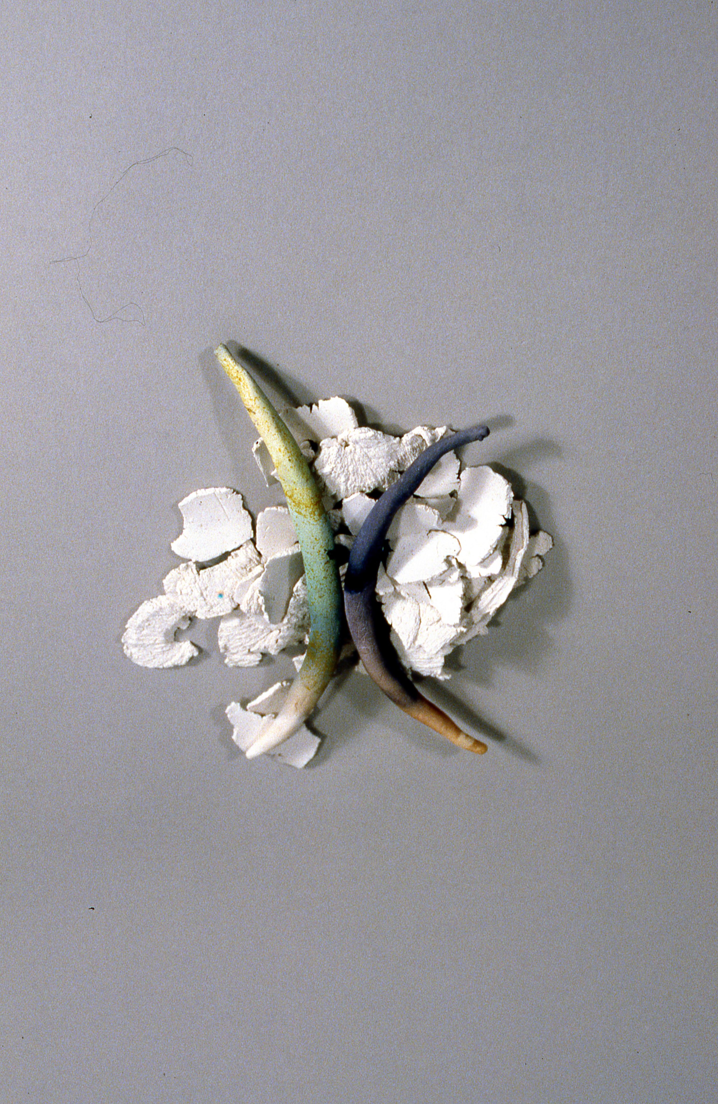 Two Bones With Flakes, KBDesrosiers, 6%22x6%22x1%22, fired and stained clay.jpeg