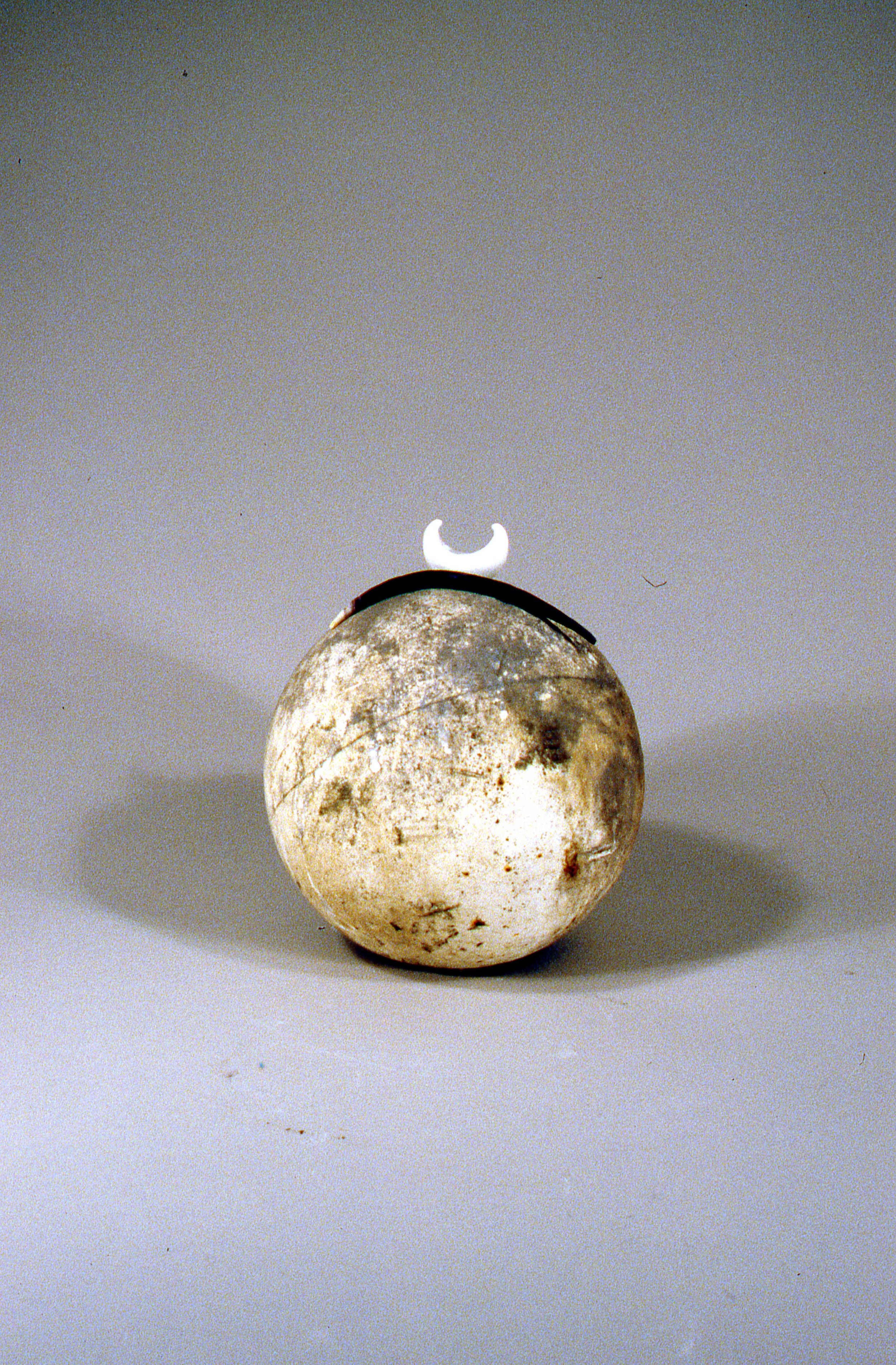 Canoe Following Bone Route Across Globe, KBDesrosiers, 12%22x12%22x12%22, cement sphere, fired and stained clay.jpeg