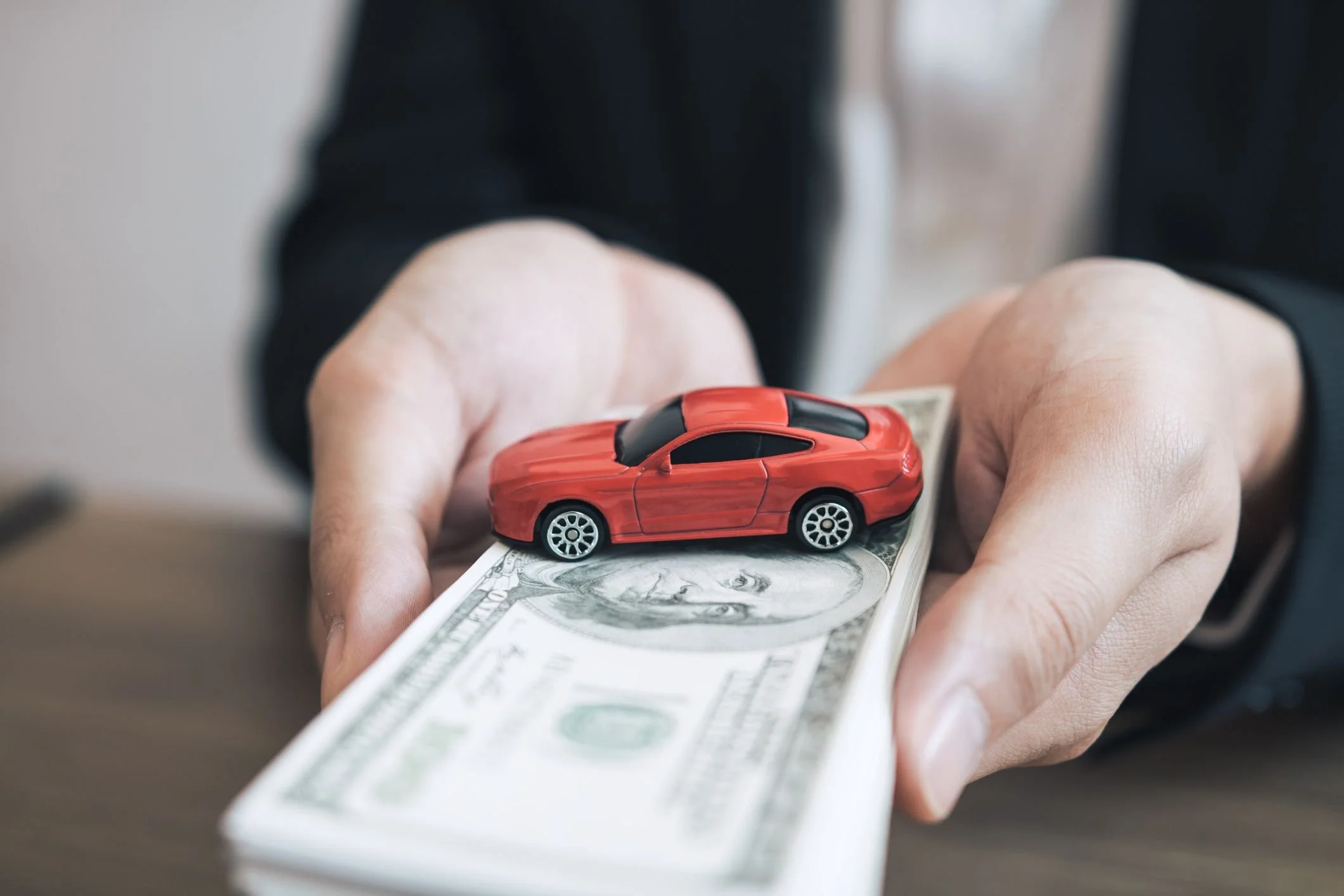 midsection-of-car-insurance-agent-holding-paper-royalty-free-image-1585339899.jpg?format=2500w