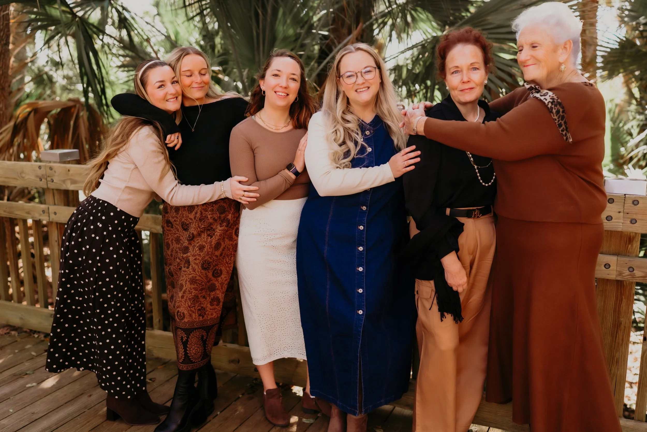 Woman holding a child on a beach