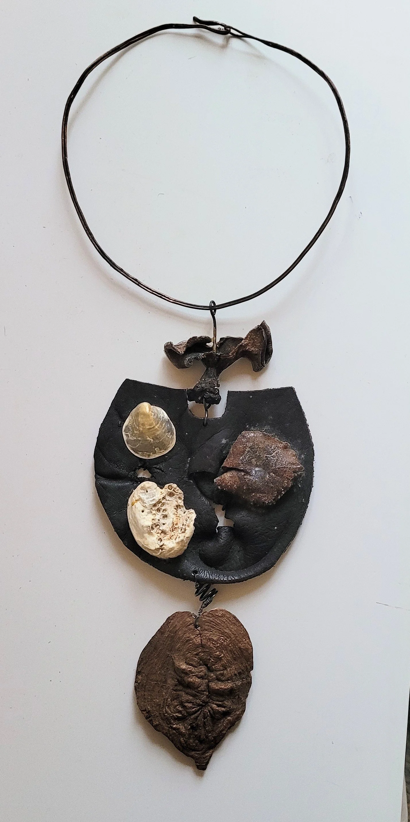 Domain of Relics , ca. 1970s, 15" x 6", leather, bone, shell, tree fungus, copper neck piece