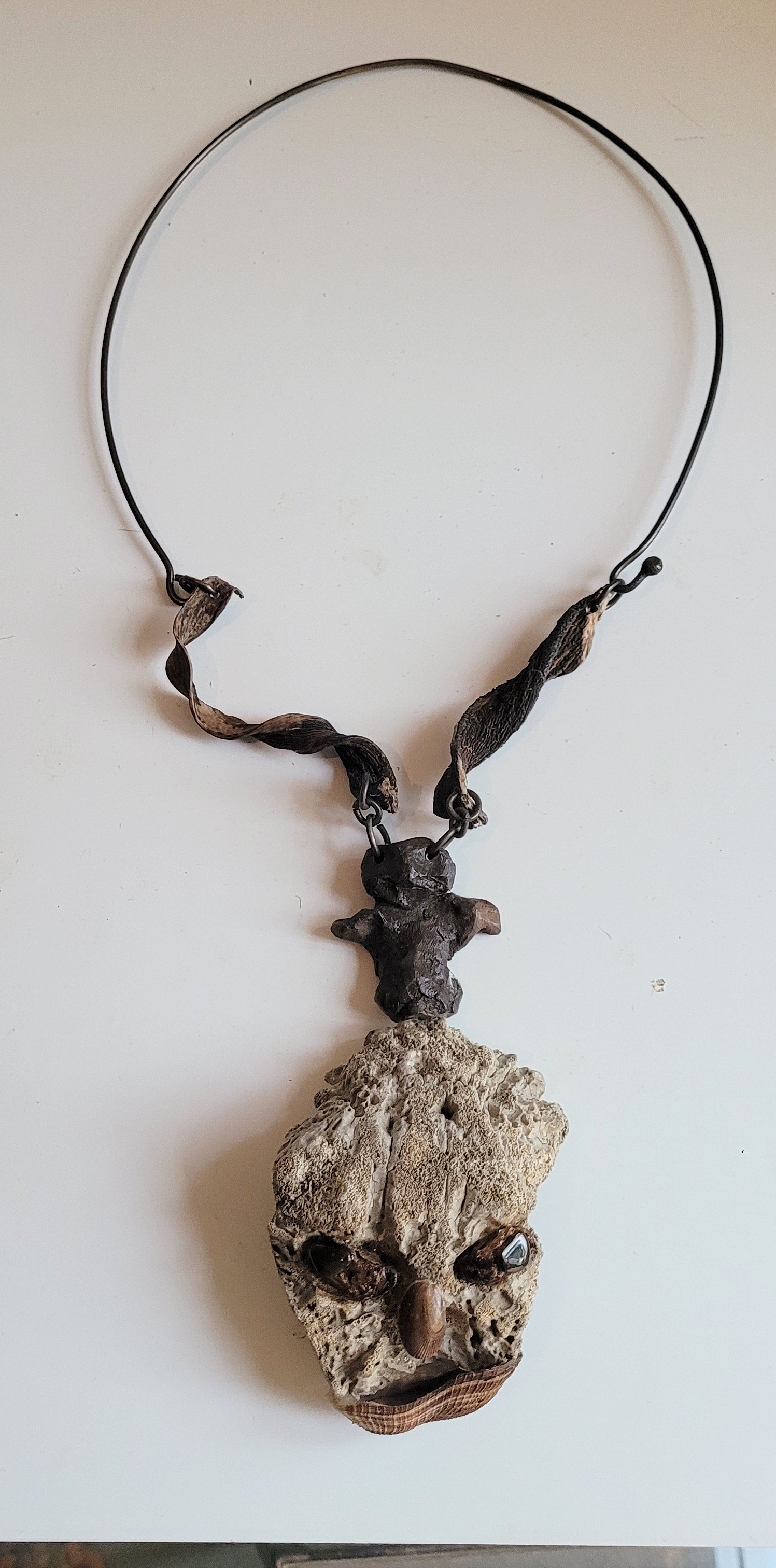  Voice of Conscience , ca. 1970's, 14"x 7",  seaweed, calcified bone, beetle eyes, shell, clay man, silver neck piece