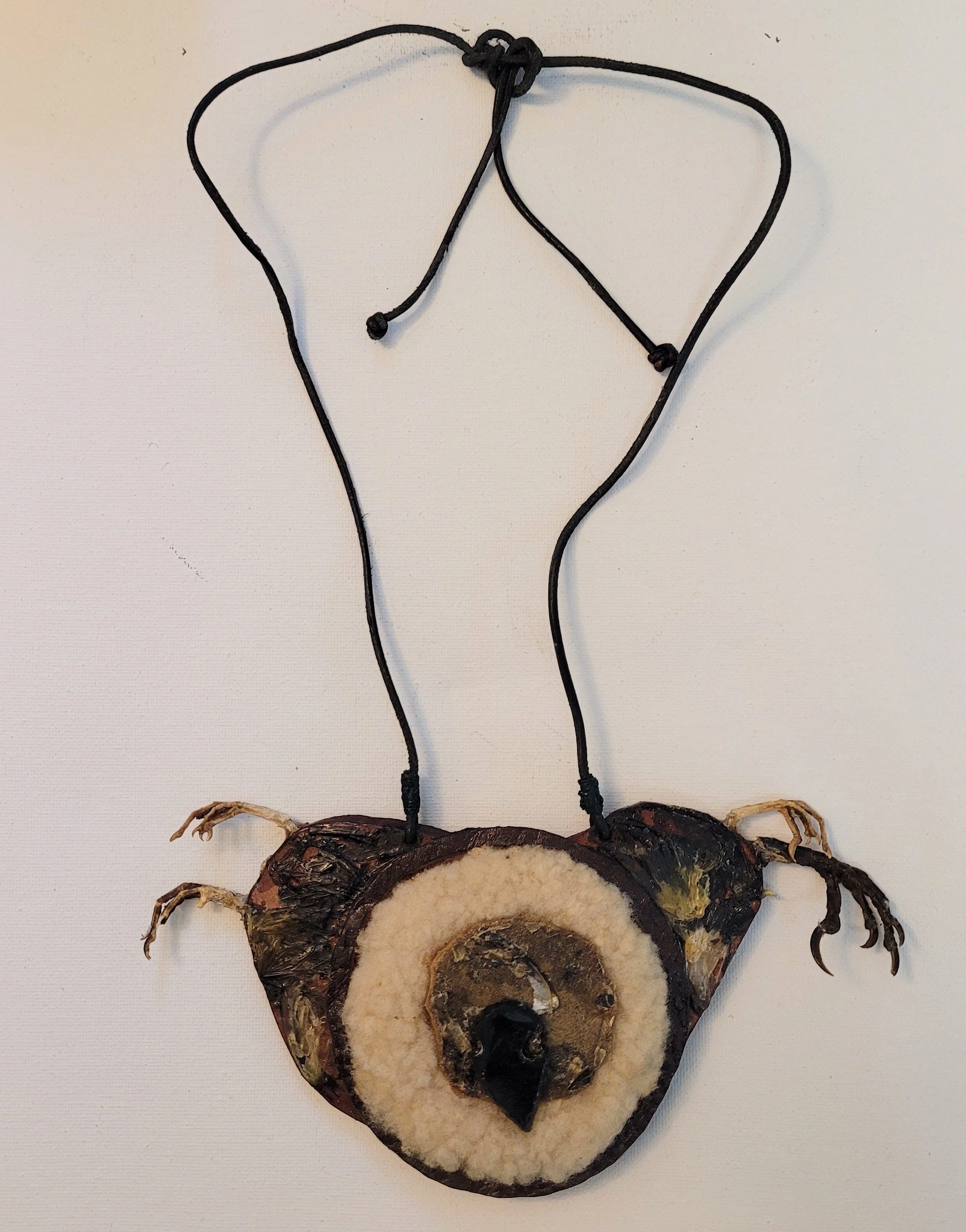  Claw Spirit , 1970s, 12 "x 7", birds feet, leather, butterfly wings, gem stone, lambs wool