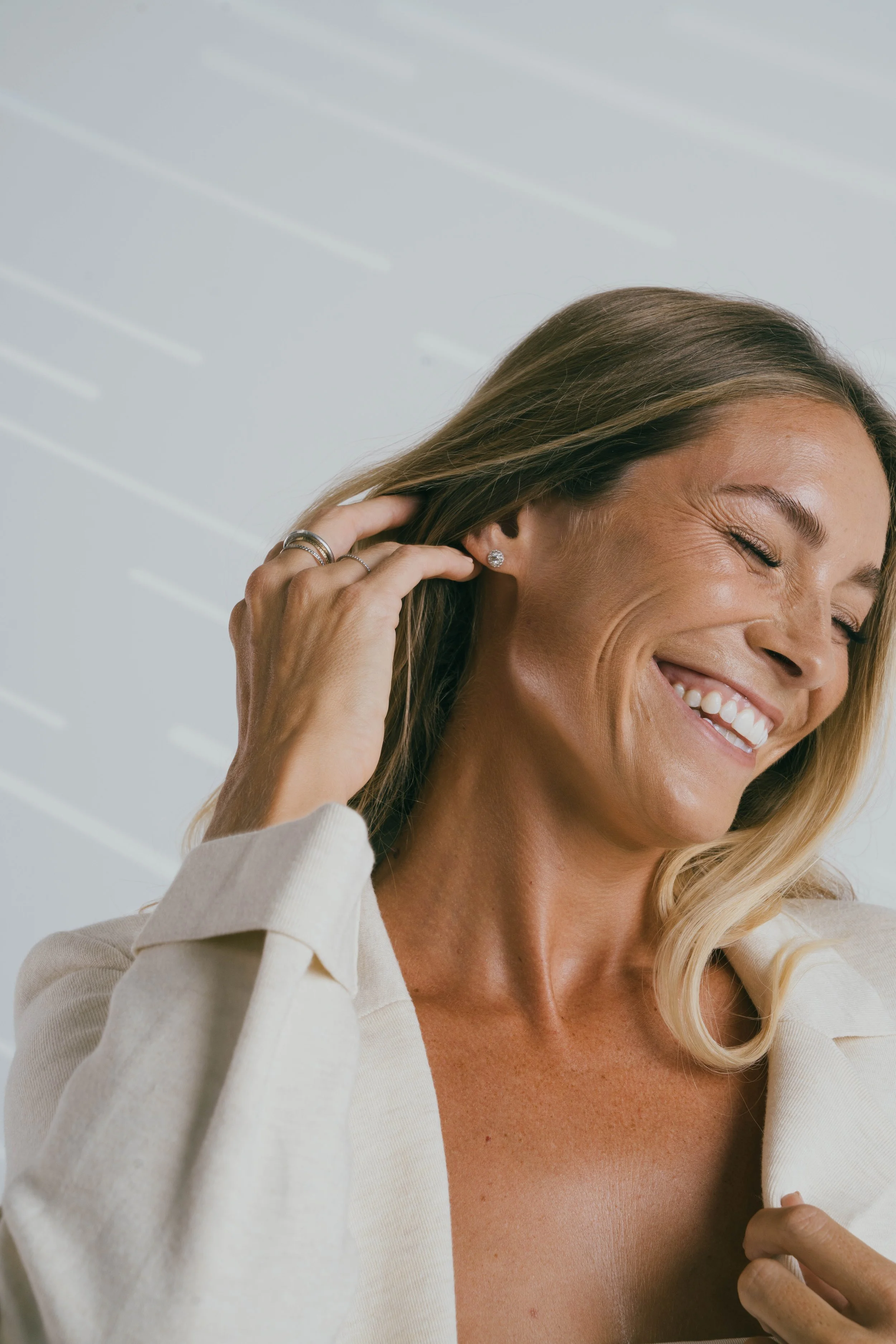 Studio beauty headshot of model Megan Koval with soft natural makeup.