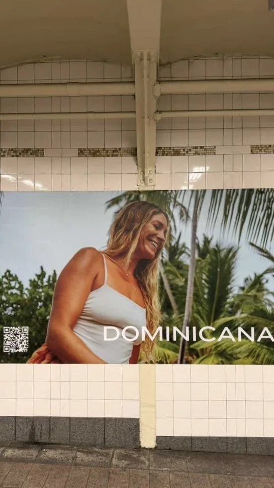 Tourism campaign billboard featuring model Megan Koval displayed in Grand Central Station in New York City.