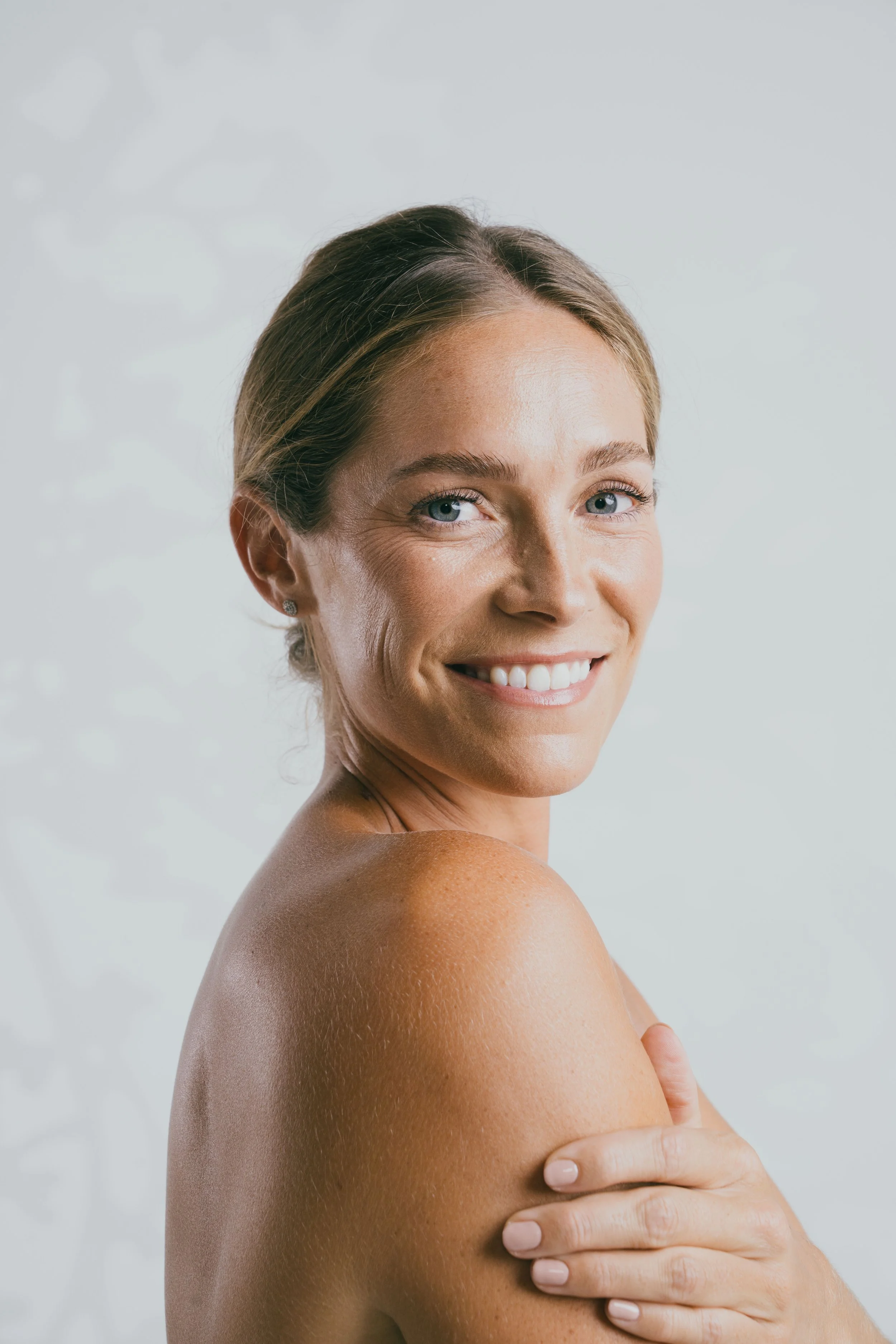 Skincare beauty portrait of Megan Koval with natural glowing skin.