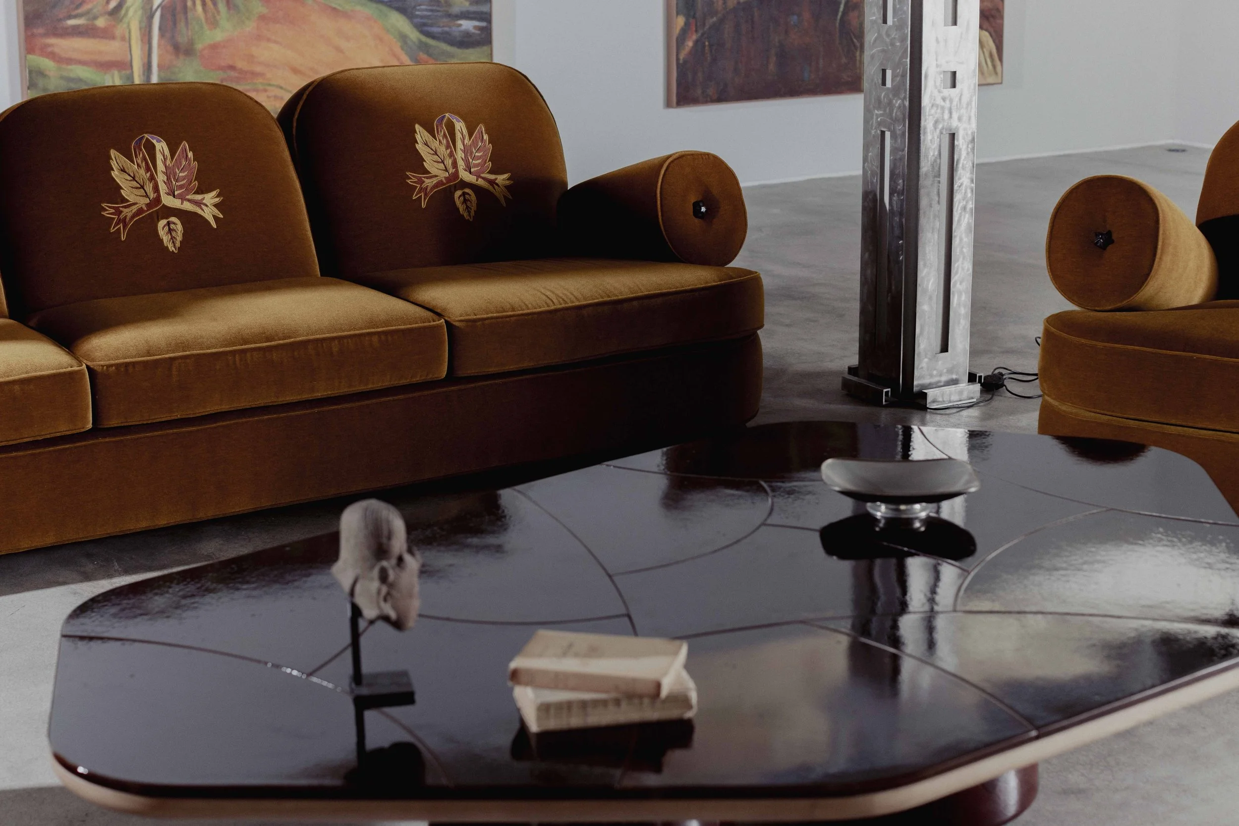 Embroidered velvet sofa and a glazed ceramic table at Alegria