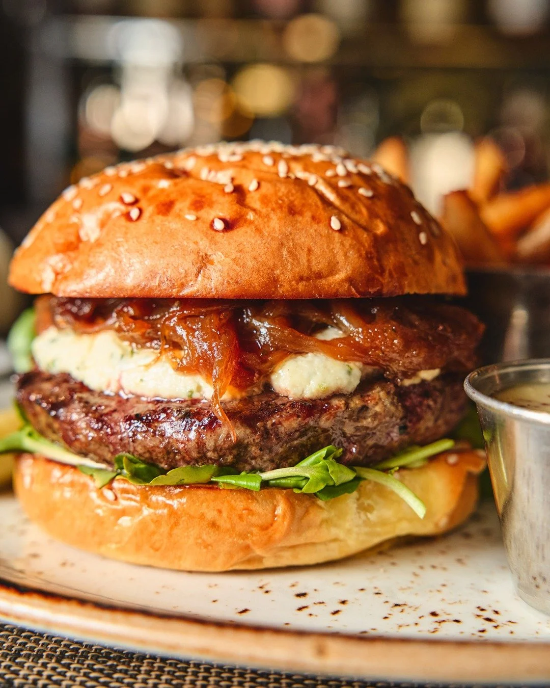 The Julia Burger: Savenor&rsquo;s beef topped with brandy-caramelized onion marmalade and creamy Boursin cheese. Bon app&eacute;tit!

📸 @briansamuelsphotography