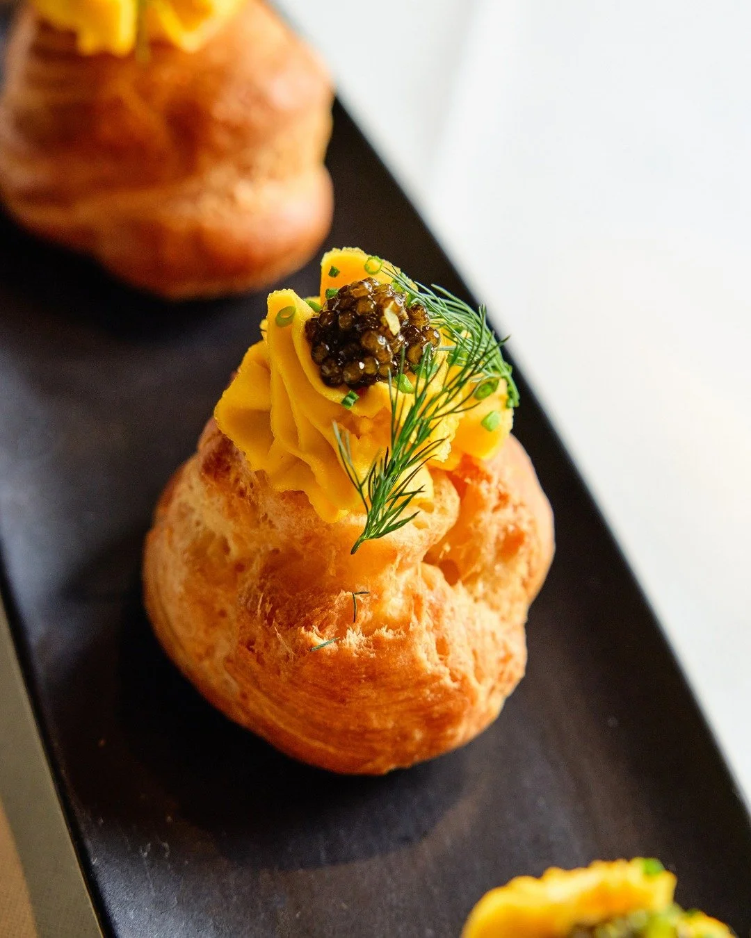 Goug&egrave;res with kaluga caviar: the perfect start to any meal.

📸 @briansamuelsphotography