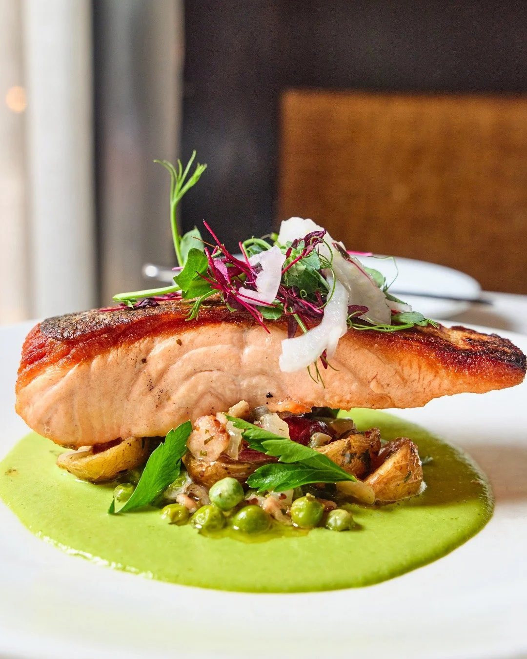 Pan-Seared Salmon | warm new potato salad, bacon, peas, fennel, spinach cream

📸 @briansamuelsphotography