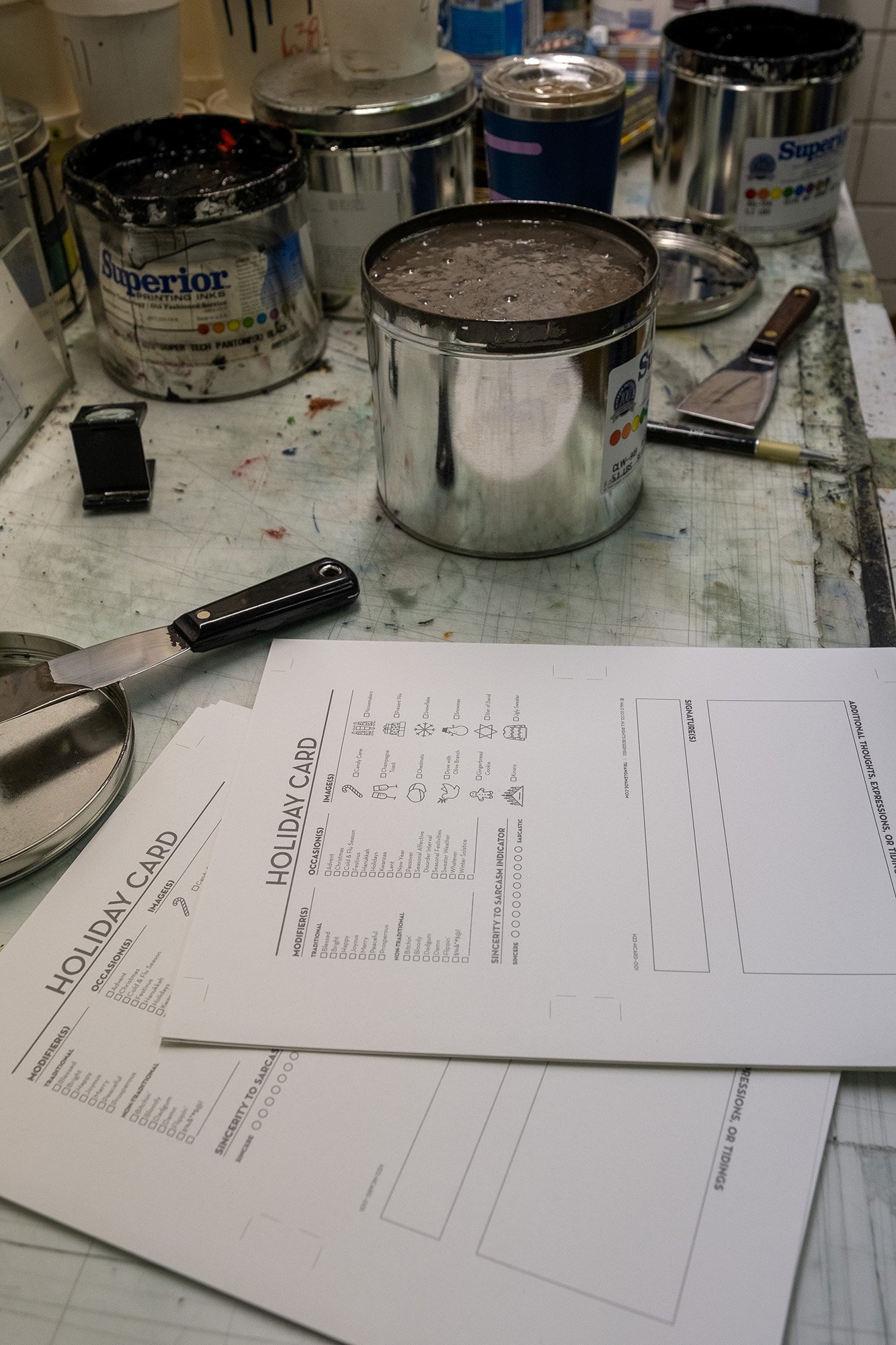 Print proofs for review on the ink mixing table.