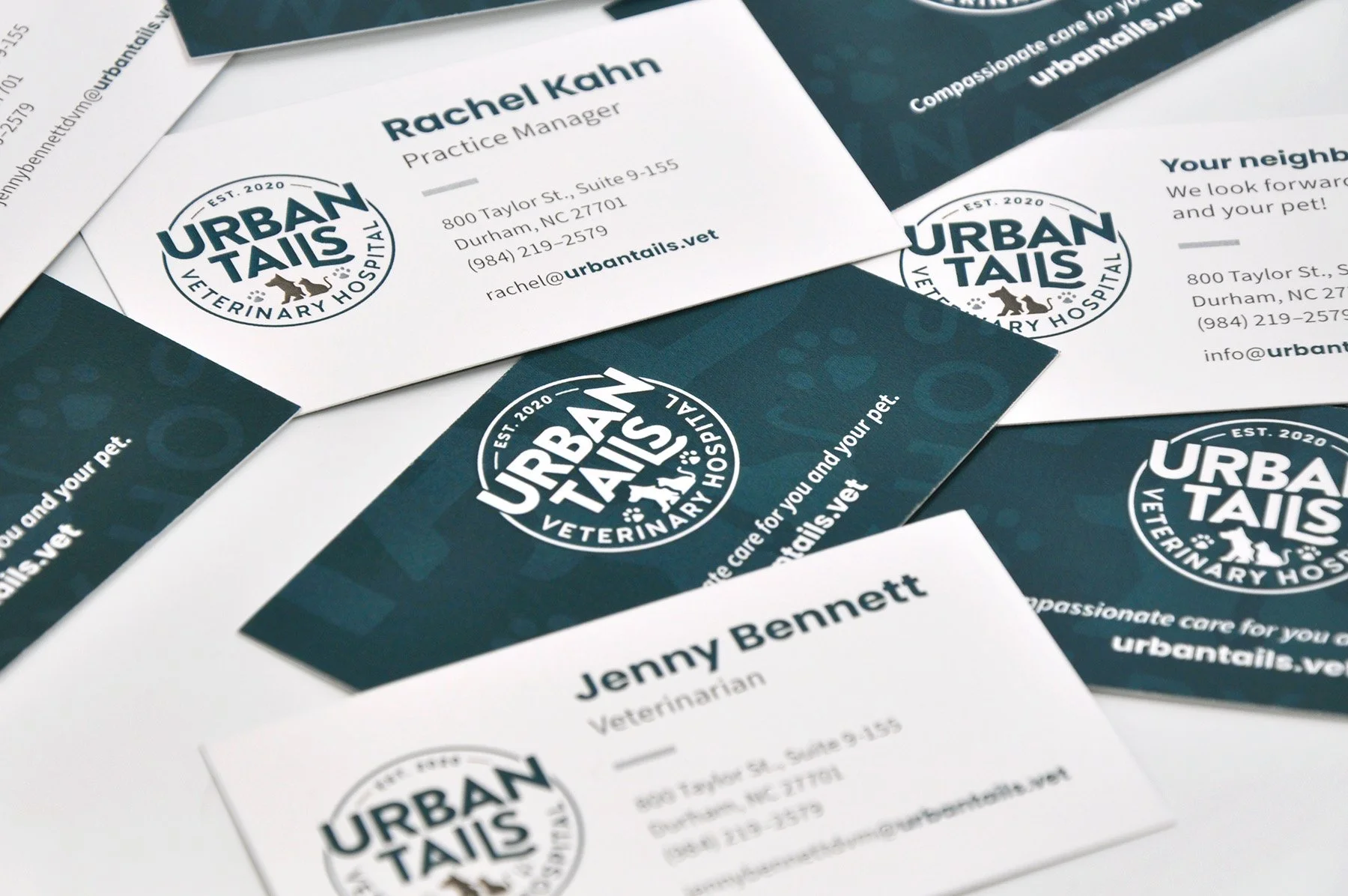 A stack of Urban Tails business cards.