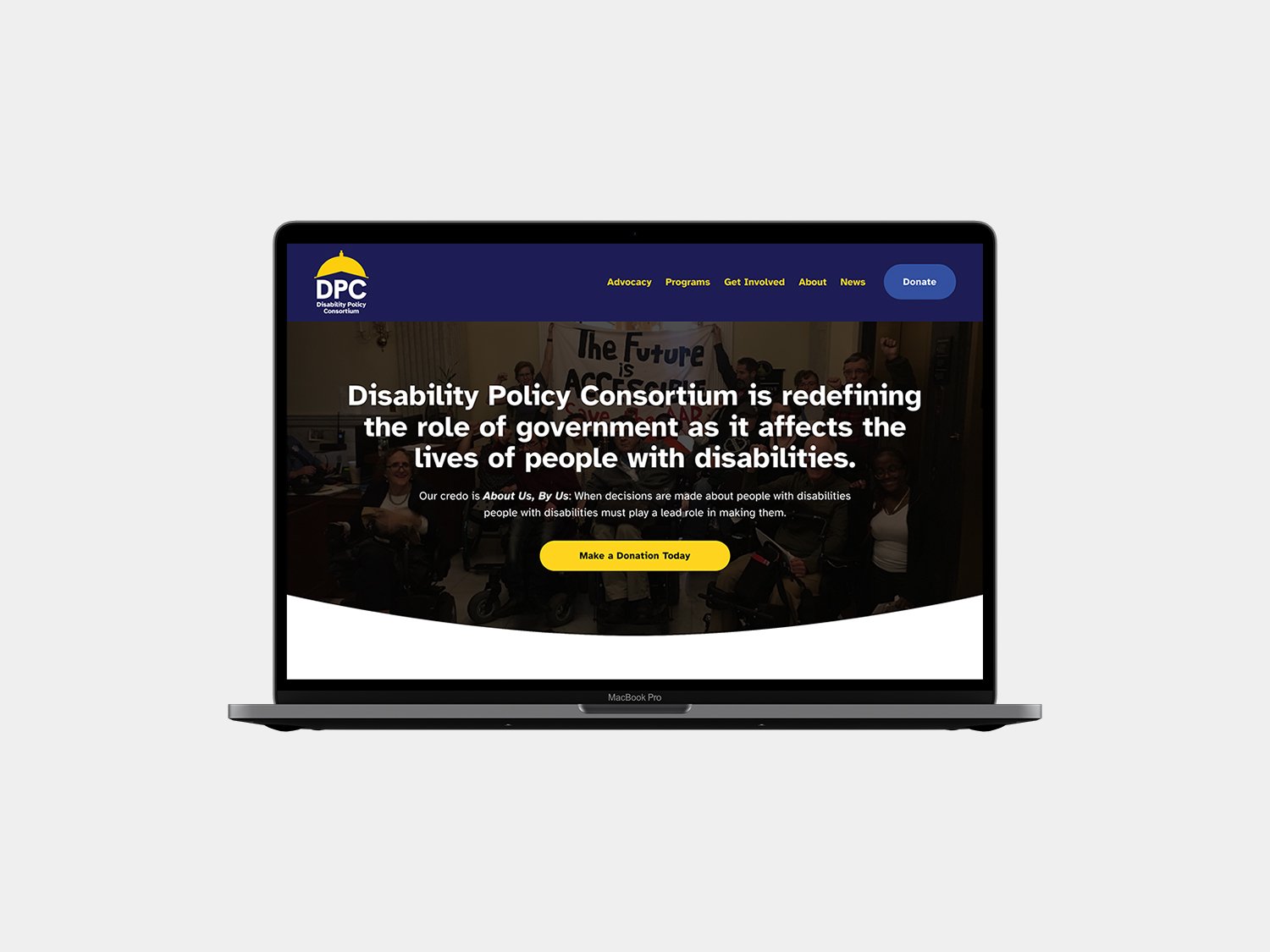 The Disability Policy Consortium website homepage displayed on a laptop.