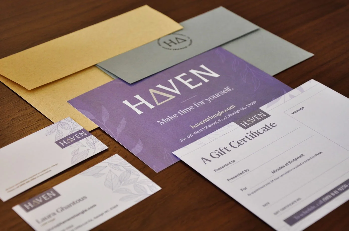 Haven promotional materials, including a purple business card, gift certificate, and envelopes.