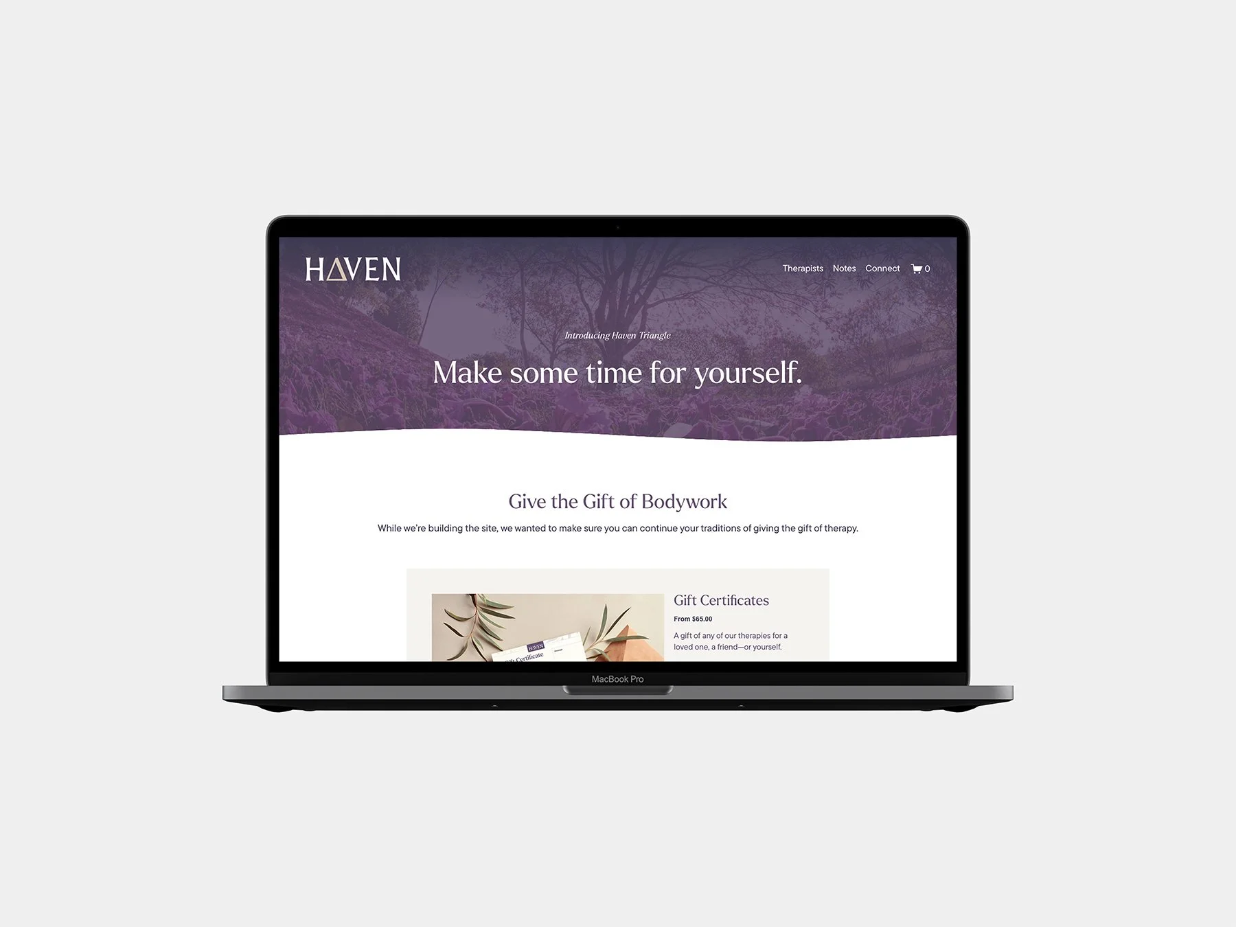 The Haven Triangle website displayed on a laptop.