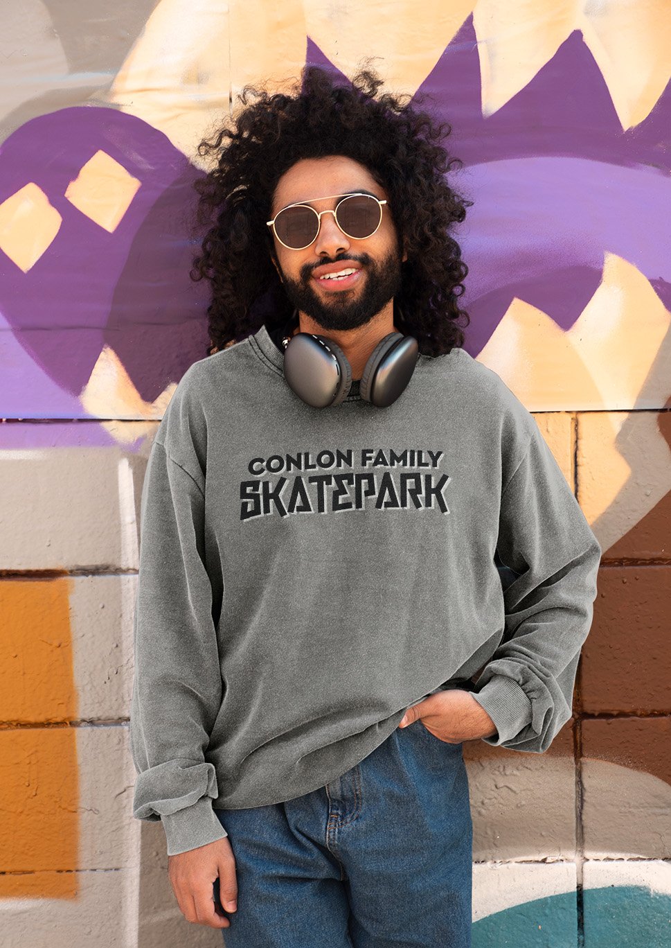 The Conlon logo on a gray shirt.