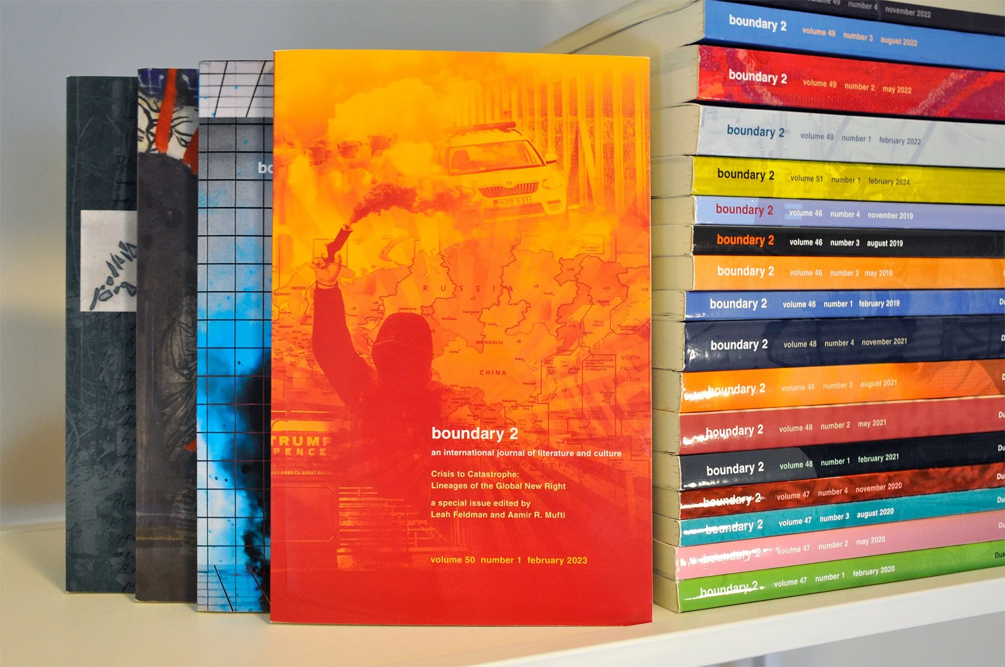 b2 volume 50 issues upright next to stacked issues.