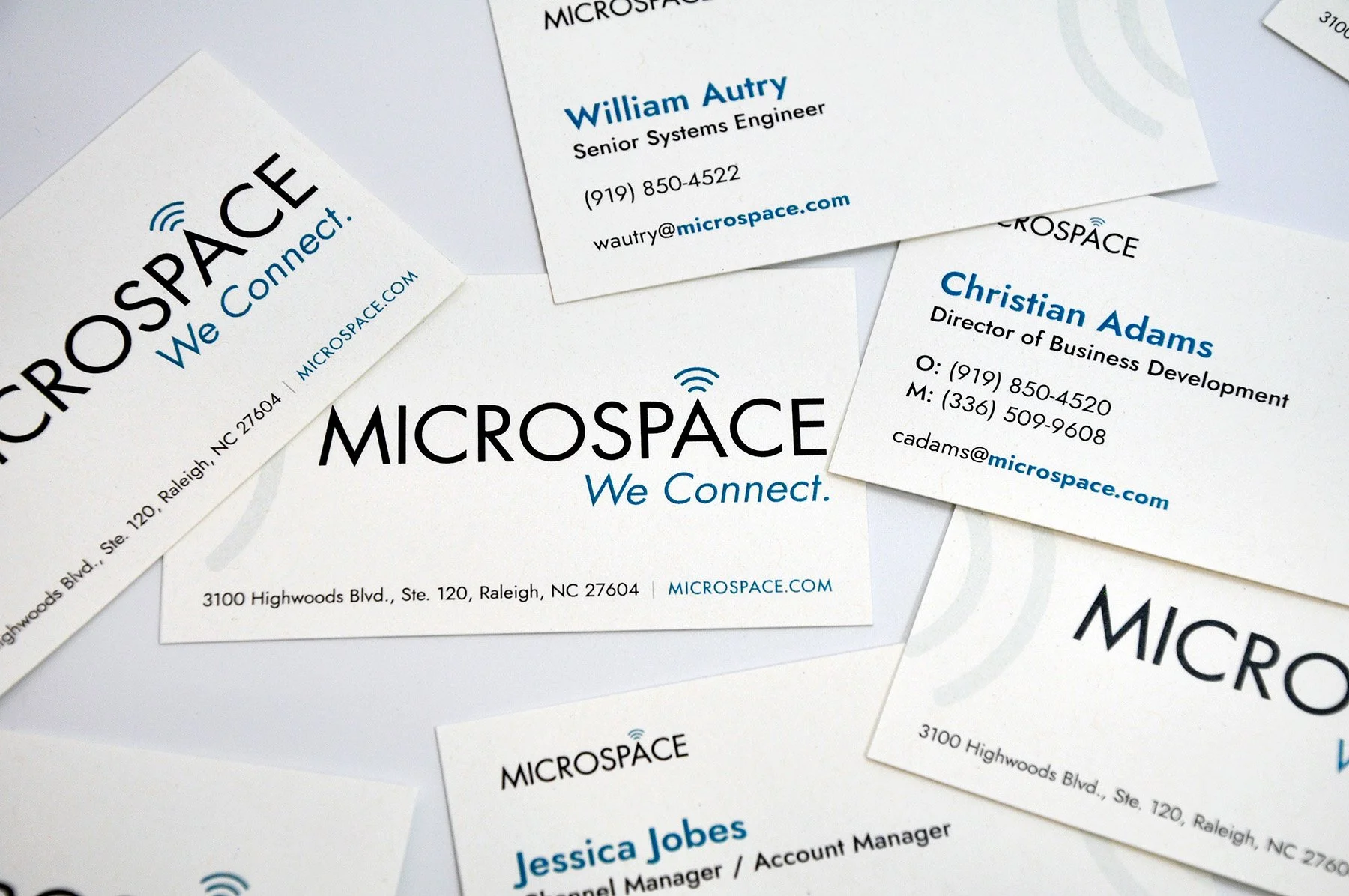 A stack of Microspace business cards.