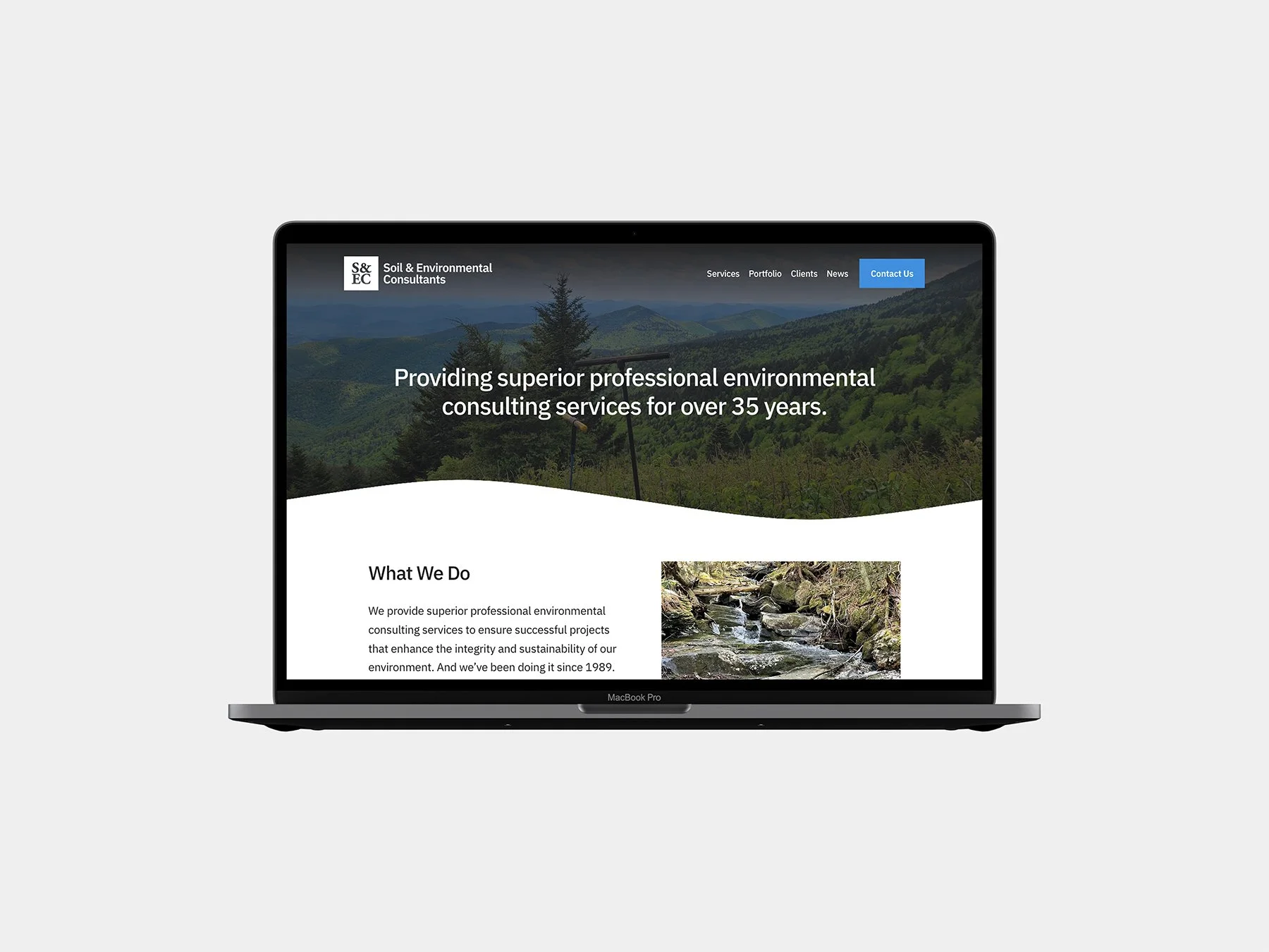 The new S&EC website homepage design displayed on a laptop.
