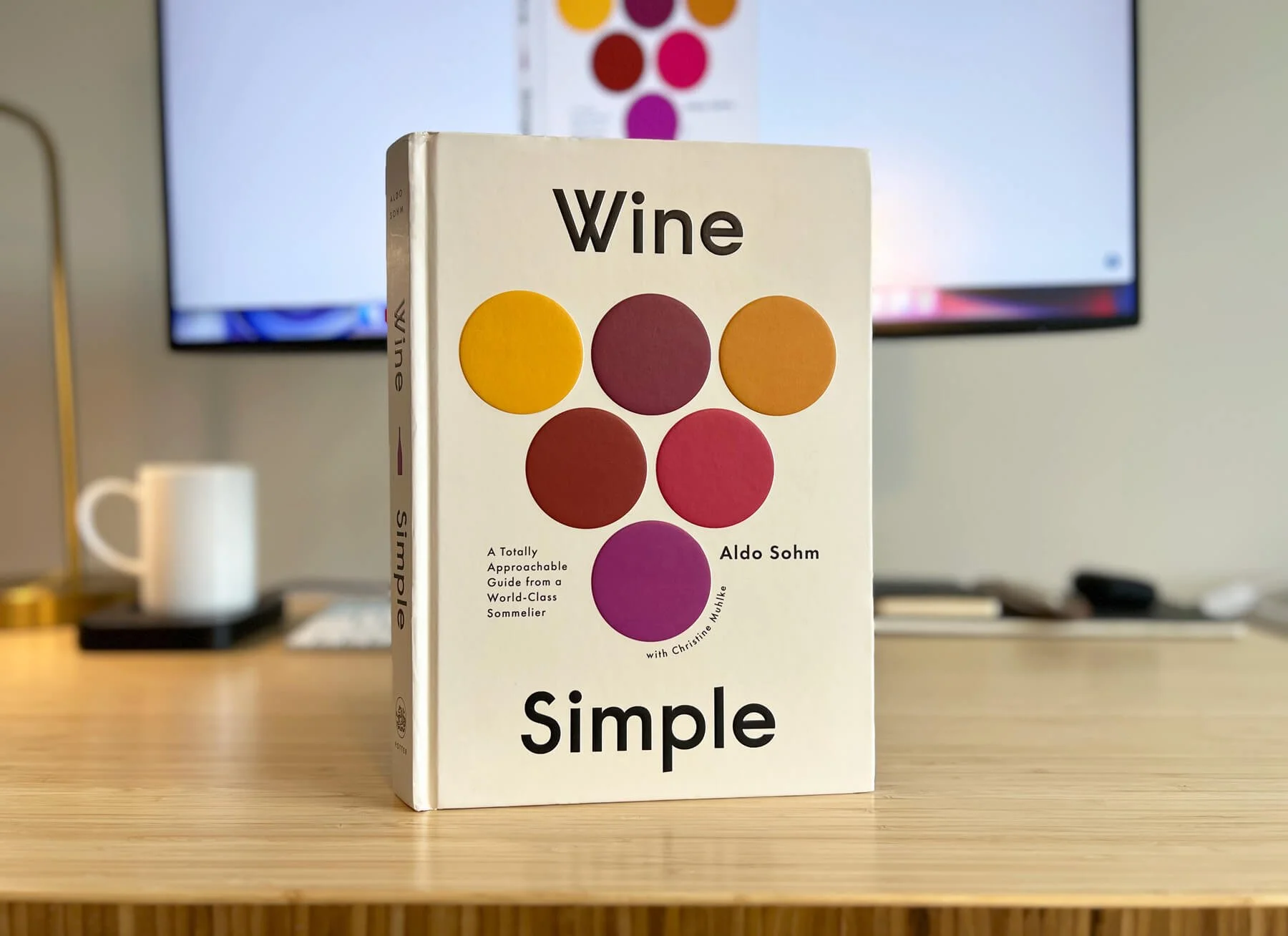 A photo of the Wine Simple book on a desk.