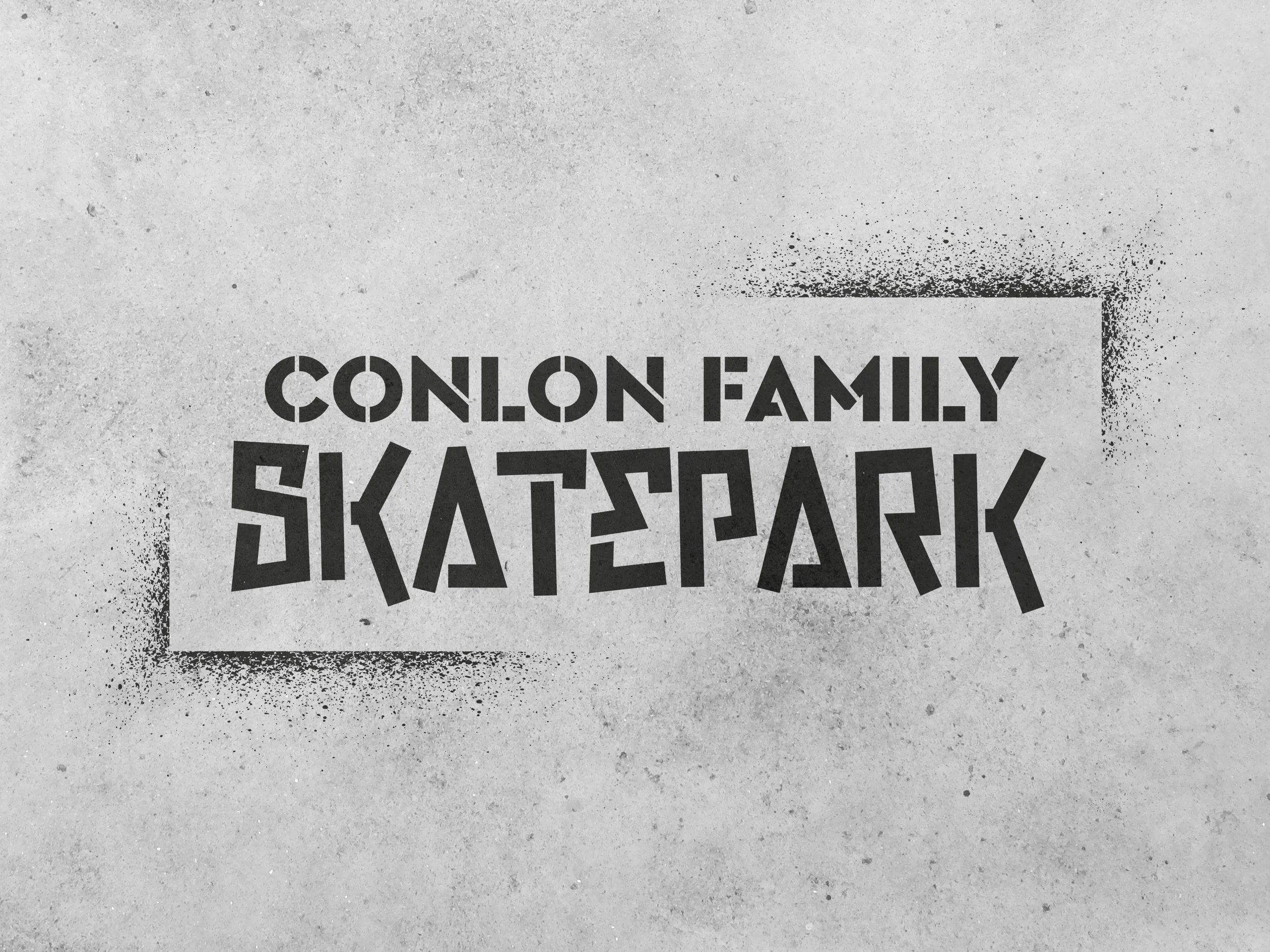 The Conlon logo stencil on a cement wall.