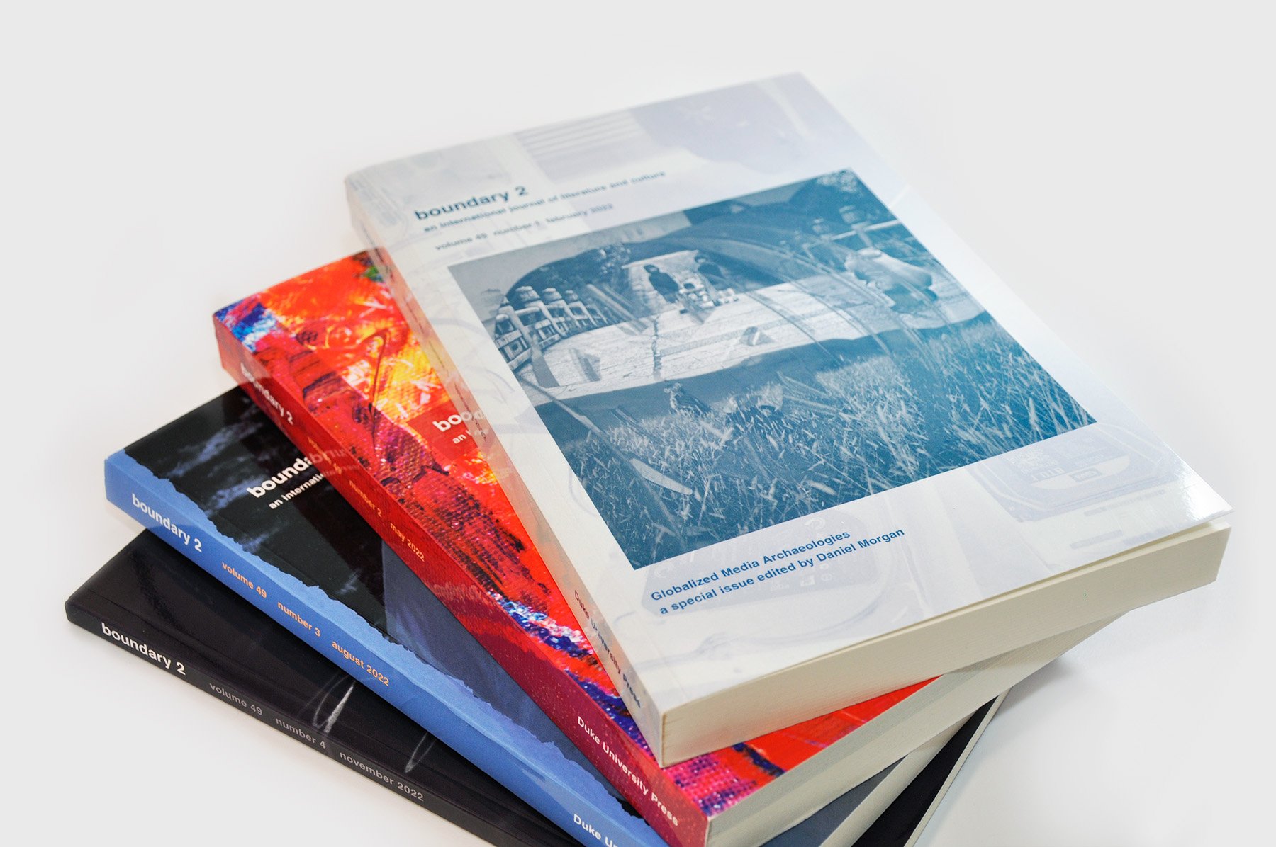 A photo of b2 volume 49 covers stacked.